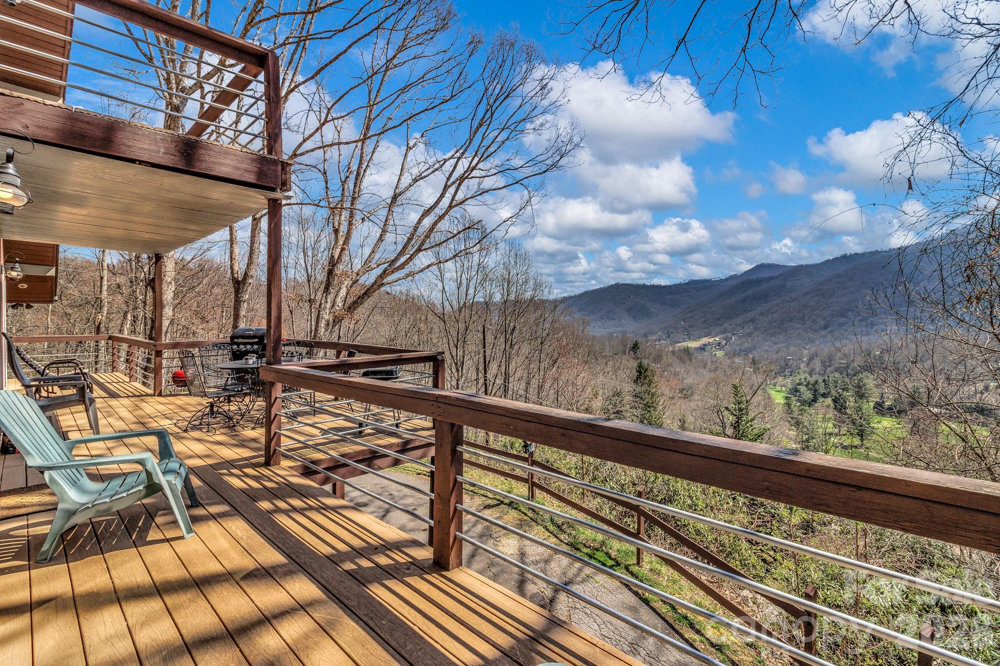 Welcome to 80 Hidden Falls Road, currently a successful short-term rental, this mountain home offers incredible long-range views and a flexible layout in the heart of Maggie Valley. Perched above the Maggie Valley Golf Course, this 4-bedroom, 4.5-bath property is designed to take full advantage of its scenic surroundings while providing comfortable, functional living space.

The main level features an open-concept design with a spacious living area centered around a striking stone fireplace—perfect for gathering after a day in the mountains. Large windows bring in natural light and frame the surrounding views, while the layout flows easily into the kitchen and dining areas.

Downstairs, a finished lower level offers additional living space, including a recreation area with a pool table—ideal for entertaining guests or creating a fun retreat atmosphere. With multiple levels and ample room to spread out, the home works well for hosting, full-time living, or rental use.

The home is currently furnished, with furnishings, washer/dryer, and basement refrigerator available as negotiable items, offering added flexibility for buyers seeking a move-in ready or turnkey setup.

Whether you’re searching for a personal getaway, a full-time residence, or an income-producing property, 80 Hidden Falls Road presents a strong opportunity in a location known for year-round appeal, just minutes from local dining, golf, and outdoor recreation.