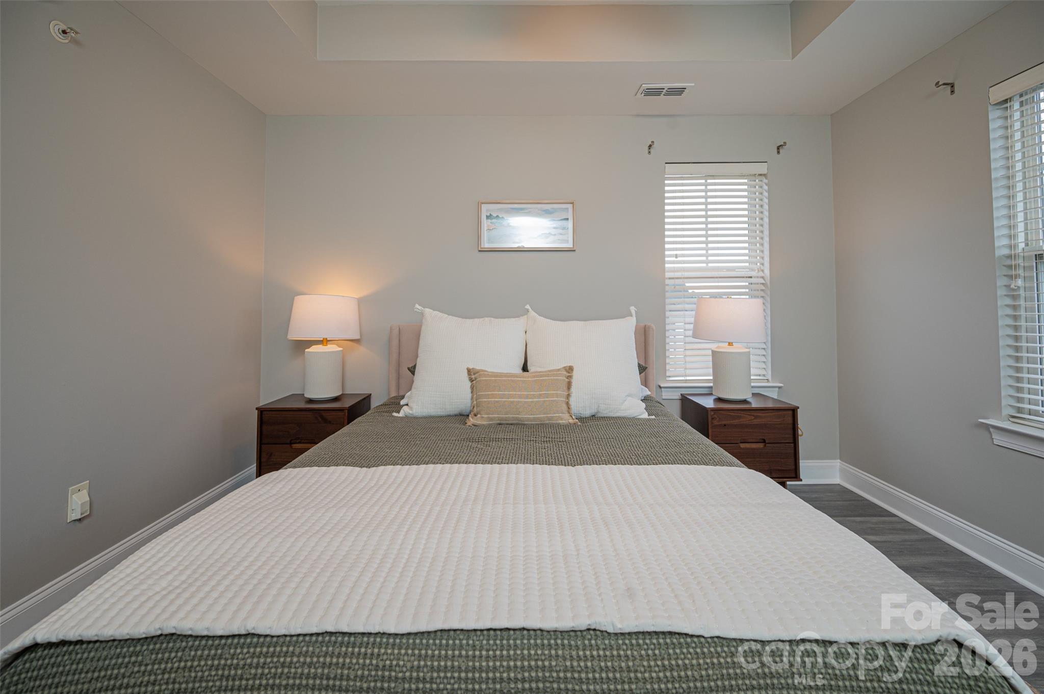Turn-key, top-floor condo offered fully furnished and ready for its next owner or investor! Whether you’re looking for a primary residence or a mid-term or long-term rental opportunity, this beautifully updated unit is move-in ready. Conveniently located near the university area, I-85, and Huntersville, it offers easy access to shopping, dining, and major employers.

Inside, you’ll find brand-new flooring, a new HVAC system, updated bathrooms and impeccable designer furnishings throughout. Vaulted ceilings create a bright, open, and airy atmosphere, while the thoughtful split-bedroom layout provides privacy with two spacious bedrooms, each featuring access to its own full bathroom.

The washer, dryer, refrigerator, and all furnishings convey, making this a truly effortless opportunity—just bring your suitcase. The community also offers additional parking and a neighborhood pool for added convenience and enjoyment.