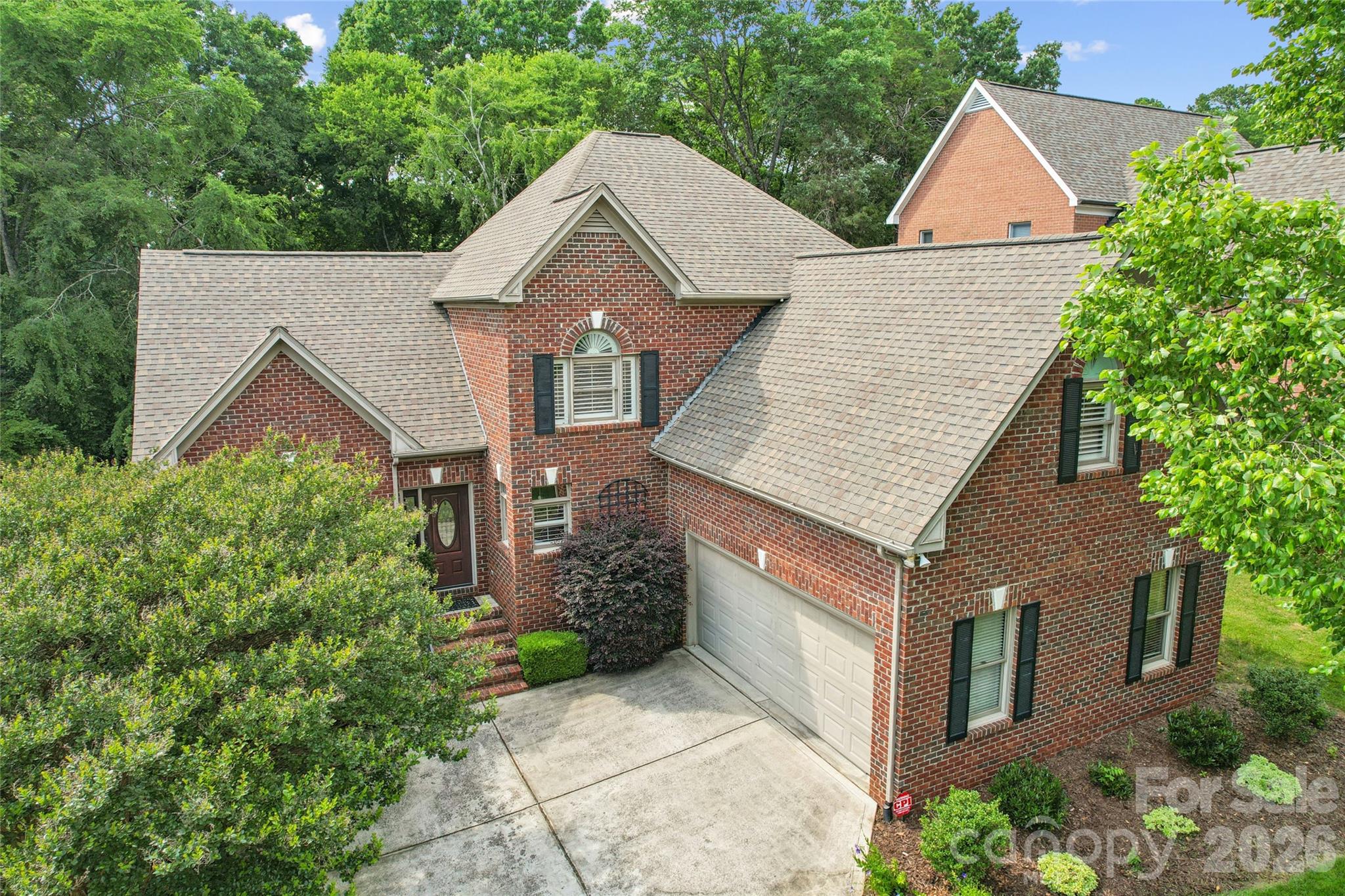 Wonderful home in a prime South Charlotte location known for its quiet cul-de-sac setting while remaining within easy reach of the city and nearby amenities. Bright, spacious open floor plan with beautiful hardwoods throughout the main level. Open-concept kitchen with granite countertops and stainless-steel appliances, flowing into the formal dining room, living room, and breakfast area. Spacious primary suite on the main level with upgraded bath and walk-in closet. Upper level features a second primary bedroom/guest suite and two additional bedrooms, one currently used as an office with a custom built-in desk and street view. Ample storage includes a two-car garage with built-in cabinets and shelving, walk-in attic, and additional walk-in closet. High-ceiling screened porch overlooks the fenced backyard with water feature, brick patio, irrigation system, mature trees, and professionally designed landscaping. Conveniently located with quick access to SouthPark, Ballantyne, Uptown Charlotte, and I-485, offering both privacy and accessibility. No HOA