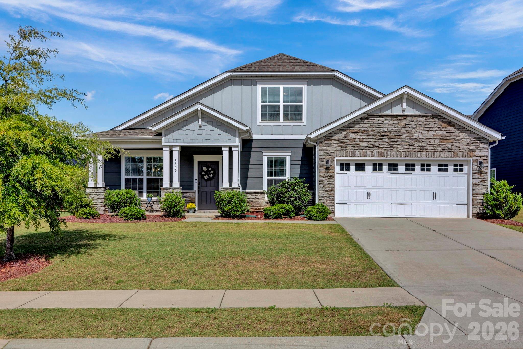 Just over the South Carolina line, enjoy lower taxes while being less than 10 minutes to Ballantyne with endless dining and entertainment options. Nestled in the Covington community, residents enjoy generous common areas, a sparkling pool, and a playground. Maintained in near-new condition, this home was built in 2021 and lightly lived in. This home shines with a low-maintenance fiber cement exterior and a thoughtfully designed open floor plan filled with natural light. The layout offers the option for main-level living, featuring a spacious primary suite, two additional bedrooms, laundry, and garage (with EV hook-up) all on the first floor. The kitchen is a chef’s dream with an oversized granite island, double ovens, a gas range, and two pantries for extra storage. Extend your living space outdoors on the screened-in back porch, the perfect spot to relax and unwind. Back on the market to no fault of the seller. The buyers' buyer backed out.