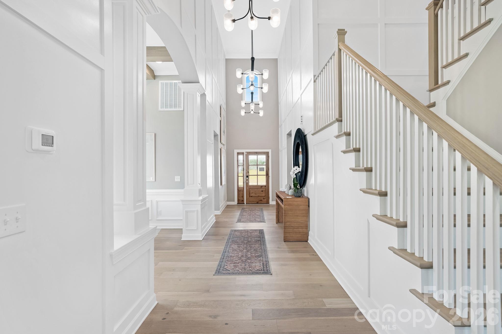 Prepare To Be Impressed!!! Step into pure luxury, a former Model Home where designer flair meets everyday comfort in desirable Camellia Gardens in highly sought after Harrisburg, NC. This 5 bedroom, 4 full bathrooms along with a media room is sitting on a level, oversized 0.3 Acres Lot.
As you enter, be captivated by the dramatic two-story foyer with three elegant chandeliers that create a grand, welcoming first impression. Just beyond, the formal dining room showcases a sophisticated coffered ceiling, setting the perfect tone for memorable gatherings & refined entertaining along with in-built speakers throughout the house.
This 3600 sq ft masterpiece is dripping with high-end upgrades, from its chef-inspired quartz kitchen to the gleaming hardwoods that lead you through a sun-drenched, open concept layout. Selective upgrade list can be found in the attachments.
Main level boasts an expansive spa-like primary suite along with a flexible main level bedroom with full bath provides convenience for guests, multi-generational living or a private home office. Main level laundry, large mud room, spacious living room with built-ins and fireplace are additional things to boast.
The Second Floor impresses with its own array of versatile spaces: a bright loft with built-in desks ideal for homework, remote work or creative projects, a dedicated media room perfect for movie nights or game days plus  3 large additional bedrooms & 2 full baths.
Outside, enjoy the oversized backyard under a covered porch - perfect for outdoor dining, play, a cozy fire-pit and future landscaping dreams (like a pool along with outdoor kitchen!!). This beautifully landscaped lawn has in-ground sprinkler system, accent focus lights highlighting the home's architecture - enhancing nighttime curb appeal.  The neighborhood has excellent community amenities like outdoor pool, playground, walking trails, sidewalks etc. Just steps away from Stallings Road Park, offering even more green space & recreation.
PRIME LOCATION : Located in the thriving town of Harrisburg, you're minutes from top-rated schools (including Harrisburg elementary, Hickory Ridge middle & High), shopping, dining, grocery stores and major highways for easy  commute to Charlotte, Concord & beyond. This is suburban living at its best - quiet, peaceful & convenient.
With modern construction, breath-taking upgrades, this home is truly move-in ready. Whether you're looking for room to grow, dedicated spaces for work & play or a sophisticated home to entertain, this home checks every box! Most of the beautiful furniture & decor are available to purchase at a highly reduced cost! Just come and unpack your suitcases, it is truly move-in ready.