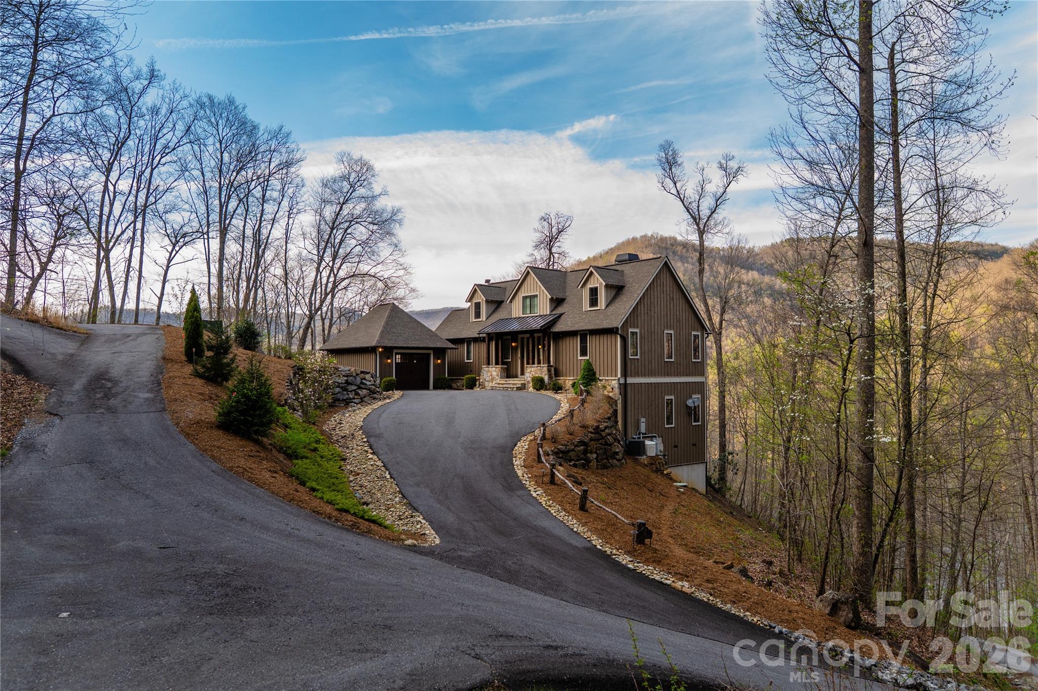 Picture perfect best describes this beautifully appointed, fully furnished 3-bedroom, 3.5-bath quality custom built home. Perched mid-mountain and just above the lake, this retreat blends refined mountain living with effortless access to the lake club, golf course and amenities. Thoughtfully designed across two levels, the home captures sweeping, year-round lake views while offering comfortable gathering spaces both inside and out.
The main level welcomes you with an open-concept living area, with natural light pouring into the home from expansive windows that reveal the natural beauty beyond. The great room features vaulted ceilings and a natural stone gas fireplace that flow seamlessly into a spacious dining area. Your family and friends will enjoy gathering in the gourmet kitchen that includes high-end appliances and a large quartz kitchen island with the functional addition of built-in cabinets and drawers for extra storage. 
The primary suite is conveniently located on this level, with two walk-in closets and a full bathroom. Completing this level, a ½ bath, mudroom, and full laundry room add practical ease to everyday mountain living.
“Wow” is all that you will say as you step outside to the show-stopping upper deck, featuring both covered and uncovered areas so you can enjoy the scenery in any season. Whether you’re grilling in the dedicated nook, hosting sunset dinners, or savoring a quiet morning coffee, the lake views and mountains provide a constant, breathtaking backdrop.
The lower level features a living room which opens to a covered walk-out deck, two sizable ensuite bedrooms offering comfort and privacy for guests, and a versatile flex space that is currently being used as a home office/den. 
Outside, the property has been professionally landscaped, with a driveway that offers plenty of parking and that leads to a detached garage with ample storage for your lake, mountain and hiking accessories.
Modern conveniences in the house and garage include hard-wired internet/wi-fi access points and a whole-house generator for additional peace of mind. 
This home is located near the Lake Club and the golf course and the pickleball/tennis courts.

Bear Lake Reserve is an upscale gated community located halfway between Cashiers/Highlands NC area and Sylva NC in the Blue Ridge Mountains. There are many hiking trails throughout the community, and you can even enjoy the fly-fishing stream. 

The Lake Club offers fine dining, the Tap Room, the Bear n Bean store, a theater, fitness center and open and covered decks with views of beautiful Bear Creek Lake and the mountains.

The Lake Club has a large, heated pool with a separate Kids pool, along with 2 hot tubs. If you prefer, you can also enjoy the sandy beach and swim in the refreshing lake. Bear Lake Reserve’s Marina offers guests access to power boats, kayaks and canoes. Up at the summit, you can enjoy the 9-hole Jack Nicklaus golf course and a driving range. Towards the front of the community you will find the Millpond event space for small to mid-size gatherings and the Amphitheater for larger community wide events.

Bear Lake Reserve is a very active community with many events throughout the year. Come to the mountains and enjoy the 4 seasons and all that beautiful Bear Lake Reserve has to offer either as a year-round owner or, when not enjoying your mountain getaway, make it available as a vacation rental!
And please click on the video
