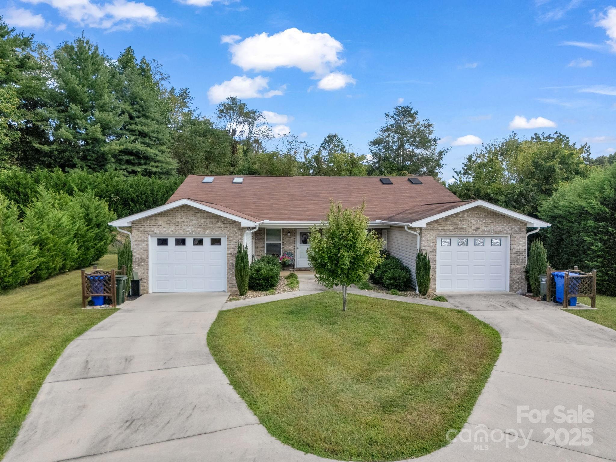 Rare investment opportunity in Hendersonville—this exceptional duplex community offers 20 total units across 10 well-built duplexes, plus an additional lot with infrastructure in place for an 11th duplex, providing the potential for future expansion. Each duplex sits on its own parcel number, offering flexibility for investors seeking long-term hold potential, resale opportunities, or condominium-style separation. Situated on approximately 4.59 acres, the property showcases thoughtful design, solid construction, and long-term care by the original owner/developer. Each residence features 2 bedrooms, 2 bathrooms, and a single-car garage, combining comfort, functionality, and privacy in a quiet neighborhood setting. The homes offer open-concept floor plans, spacious kitchens, primary suites, and inviting outdoor areas, appealing to both long-term tenants and those seeking low-maintenance living. Beautiful green spaces weave throughout the property, creating a park-like atmosphere that enhances tenant satisfaction and retention. The community is fully served by city water and city sewer and enjoys convenient proximity to shopping, dining, medical facilities, and downtown Hendersonville. With consistent occupancy, strong rental history, and evident pride of ownership, this property represents a turnkey investment with exceptional stability and future growth potential. Opportunities like this—featuring 20 income-producing units, garage parking for every residence, an additional duplex lot, and nearly five acres of landscaped grounds—are exceedingly rare in the Western North Carolina market. Whether you’re an experienced investor seeking a well-diversified asset or a developer looking for expansion and resale flexibility, this meticulously maintained duplex community offers enduring value in a prime Hendersonville location.