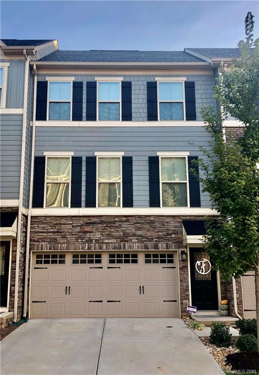 Welcome to this adorable 3 story townhome near downtown Charlotte, NC! Special features include: open floor plan, high ceilings, natural light, engineered hardwood flooring on the main floor where the spacious living room, huge kitchen, and breakfast nook are located. The gourmet kitchen features white quartz counter tops, tile back splash, huge center island with bar stool seating, SS appliances, soft close drawers, under mount pull out trash can & recycling, and plenty of storage space. Upstairs the primary bedroom has a private ensuite bathroom with a dual sink vanity and extended tile shower. Two secondary bedrooms share access to a full hall bathroom and the laundry area. The lower level features a large flex/living space & vinyl plank flooring. Enjoy time outside overlooking the lush flat yard on the back deck off the main floor living room. Located in close proximity to South Park, Uptown Charlotte, Southend, as well as the new Oakhurst Common Market retail & restaurant center.