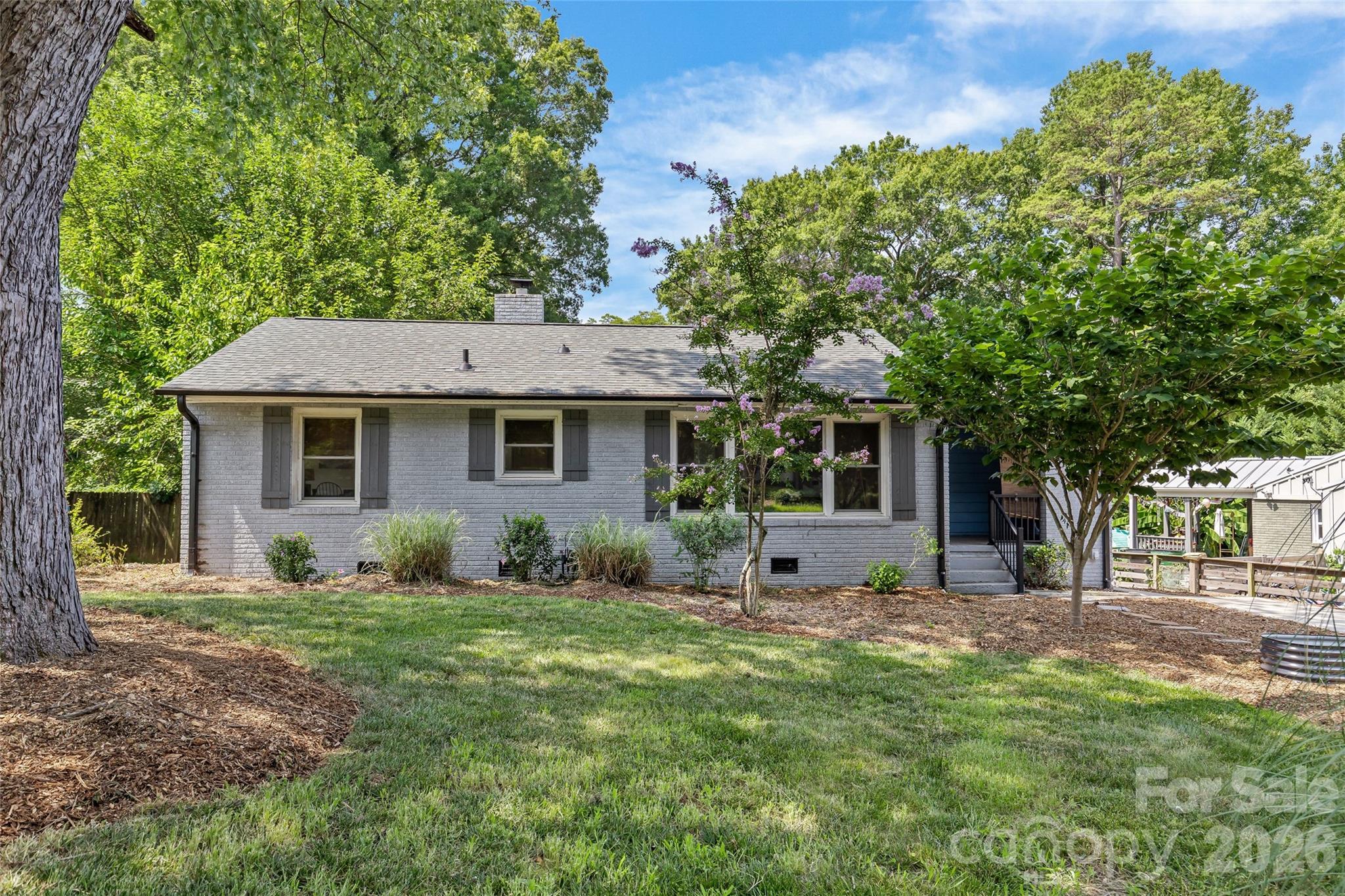 Welcome to this uber charming and exceptionally maintained cottage in the highly desirable Plaza-Shamrock neighborhood of 28205. Perfectly move-in ready, this charming 3-bedroom, 1-bath home blends timeless character with thoughtful modern updates.

Inside, abundant natural light pours through the large picture window in the living room, creating a warm and inviting space. The versatile floor plan offers flexibility for a dedicated home office, guest room, or additional bedroom to suit your lifestyle.
Step outside to a fully fenced backyard shaded by a mature tree canopy, providing a retreat that's ideal for entertaining, gardening, pets, or simply relaxing.
The home has been carefully improved for comfort and peace of mind.  The roof and windows were replaced in 2020 along with a new fridge, washer and dryer.  The HVAC system is 2025 and the main sewage line was replaced in 2023. 
With forthcoming updates by CDOT to Shamrock drive to include the addition of a bike lane, sidewalk and buffer lane, this puts you minutes from both Plaza Midwood and NoDa to enjoy incredible access to some of Charlotte's BEST like Lang Van, Post Script, Khali Yoga, Artisans Palette, Summit Coffee and so much more!