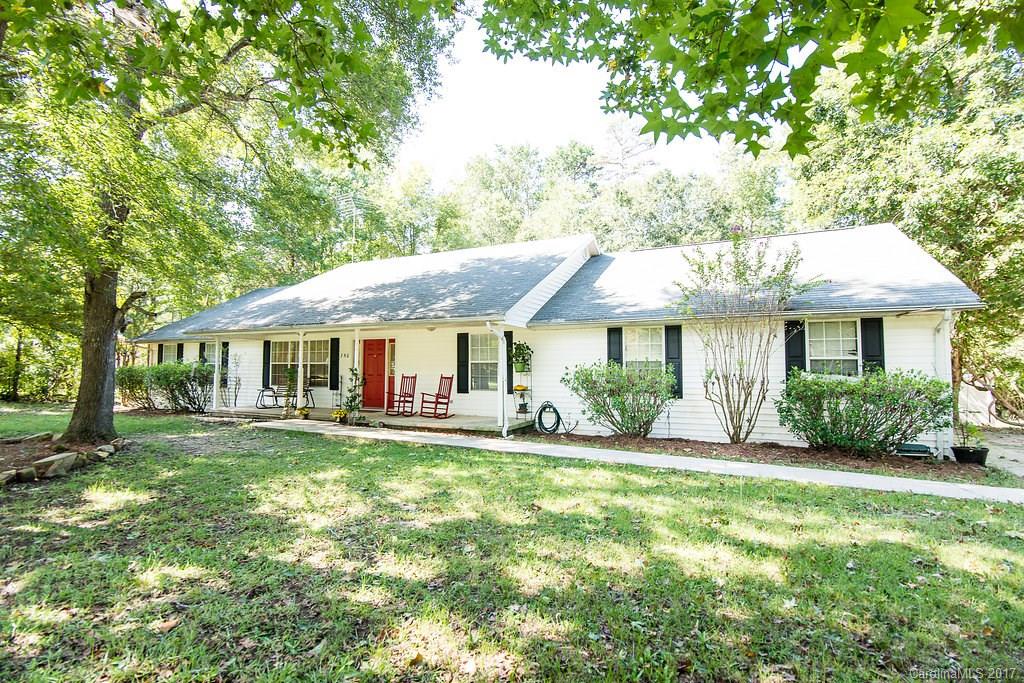Spacious home in  quiet rural neighborhood, minutes from I-77 and on 3.95 acres! This 3 bedroom/ 2.5 bath (plus an office) home boasts an open floor plan, granite counter tops, laminate wood floors, large family room, large sun room, fenced back yard, two car garage, in ground sprinkler system, and a creek on property! Home also has an in ground pool with a separate 600 foot pool house/ mother in law suite that has its own well and septic, central heat/ air and is handicap accessible!