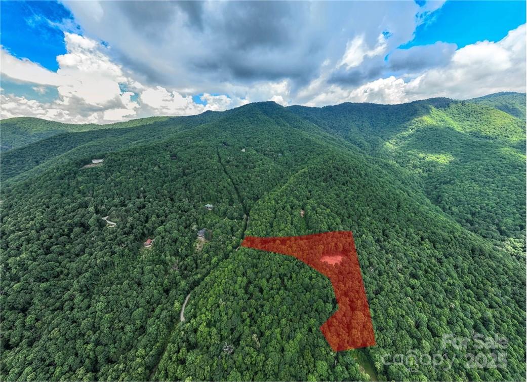 Huge potential views from these three combined parcels consisting of 6 acres. Newer driveway and freshly cleared building site allows for easy building. This high elevation, big view, property offers a highly desired SE to SW exposure within the fabled Plott Balsam Mountain Range. Choose your homesite location to build the mountain estate you've been searching for. This offering is located within the Sylva Vista Community consisting of mostly large lots with commanding long range views. This gated and private community is surrounded by the Sylva Watershed, Nature Conservancy and USFS Land. Seller has several other lots available to combine with this sale if interested. See MLS 3858768 for the master listing.  Adjoining this offering is a 160+- acreage that could also be available with cascading waterfalls, large older forests, rock outcroppings and rare fauna and flora.