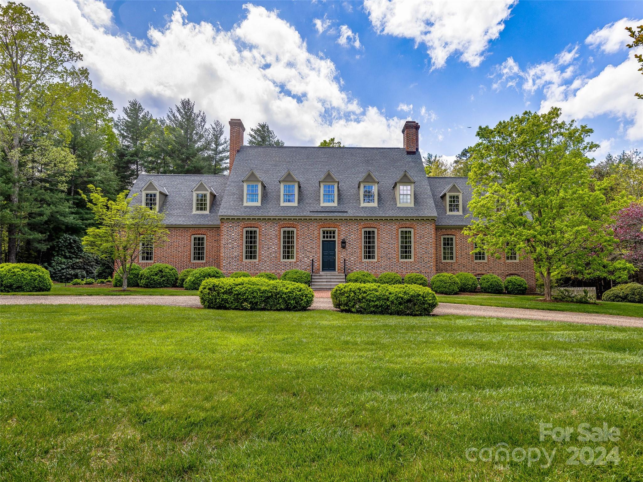 Timeless design, superb craftsmanship, and glorious gardens are the hallmarks of this exquisite
home by noted Virginia architect G. Allan Morledge. The exterior’s attractive Flemish bond
brickwork was crafted using handmade Old Carolina Brick, while four fireplaces, custom
millwork, heart pine flooring all conspire to create a warm welcoming ambience inside. On the
first floor there is a spacious primary bedroom, kitchen handcrafted by the Kennebec Company,
dining room, parlor, library/study, and living room. The second level hosts a guest suite with a
full bath and attached lounge, two additional bedrooms, and a large bonus room. The walkout
basement houses a recreation area along with an inviting “pub”. There is also space for
exercising and storage. In the back yard, a separate "cook house" serves as a garden, workshop,
or hobby area. The home lives ever so well for today's lifestyles but also incorporates the
handcrafted quality of the past.
