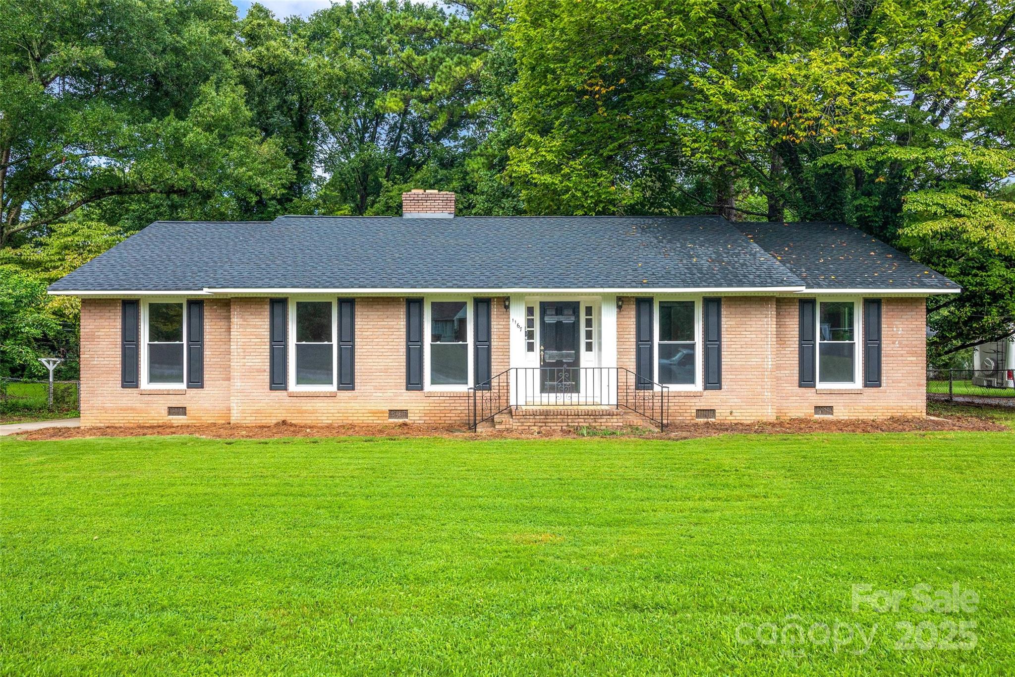 Come see this 3-bedroom, 2-bath all-brick home, beautifully refreshed with thoughtful upgrades inside and out — the perfect foundation for the next homeowner to make it truly their own. Enjoy newly refinished hardwood floors, new windows, fresh interior paint, a brand-new hot water heater, and a roof installed in 2024. The inviting family room features charming built-ins, while the large front and back lawns offer plenty of room to relax or play. A backyard storage shed provides extra space for tools and hobbies. Move-in ready with timeless curb appeal and a central Rock Hill location that keeps you close to shopping, dining, and schools.