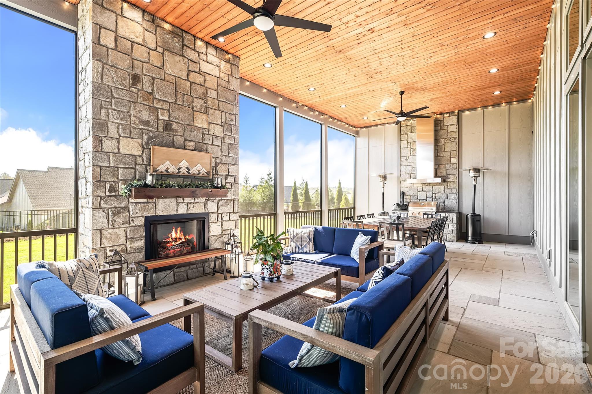 Welcome to this luxury mountain home in the gated community of Mills River Crossing. Enjoy mountain views from your front porch and a peaceful retreat in your beautiful back yard. From the moment you step inside this main level living home, you’re welcomed by a stunning natural limestone fireplace with custom built ins that bring warmth and serve as the focal point of the spacious great room. The open-concept design flows beautifully into the chef’s kitchen, where leathered countertops, premium KitchenAid appliances, and a waterfall island create an ideal space for both everyday living and entertaining. A versatile office or flex room offers the perfect retreat for work, fitness or a fourth bedroom. The primary suite is a true sanctuary, featuring dual vanities, a large walk-in double-entrance shower, and a deep soaking tub designed for ultimate comfort. Enjoy the fully screened, stone-tiled patio complete with a natural stone fireplace and built-in grill—perfect for year-round gatherings or quiet evenings at home. The generous acre sized lot can provide many uses from gardening to a sports field or whatever you choose! This home offers total peace of mind and luxury. Come see this beautiful home today.