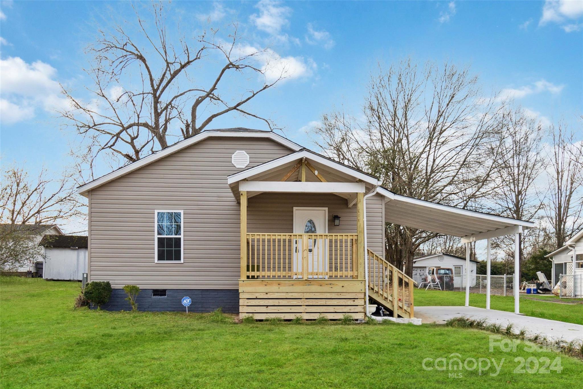 Super Cute Bungalow in downtown Clover.  This home was remodeled around 1981 & remodeled by new owner this year - to include new floorplan, wiring, plumbing, and new roof. Home is situated just minutes from downtown Clover.  All work permitted by City of Clover. Work by licensed general contractor. Home feels like a brand new home with all the updates completed. When you enter you are greeted by the spacious living area and open kitchen which features quartz countertops and stainless steel appliances. Updated cabinets, fixtures, Luxury Vinyl Plank flooring, and updated double insulated windows.  Renovated bathrooms feature updated cabinets, fixtures and decorator tile.  Enjoy your morning coffee on your covered front porch or plan those weekend barbecues on the back deck.  There is storage  in the backyard shed.  This home is situated on a flat lot.  Home includes a one year home warranty and an installed security system.  You surely won't want to miss this one ... it won't last long!