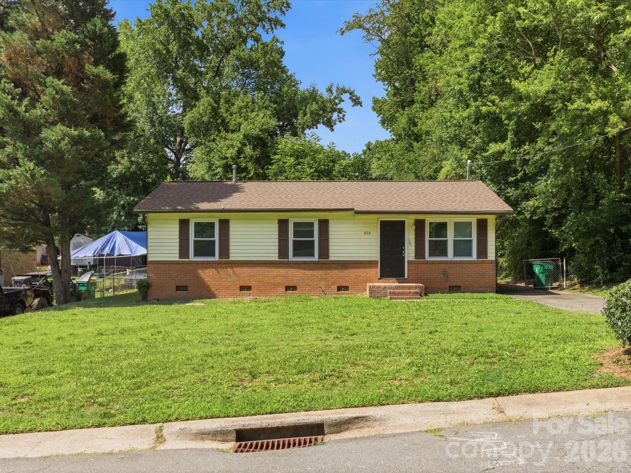 This charming 3-bedroom, 2-bath ranch offers comfortable one-level living in a convenient location. Well maintained and move-in ready, the home features a modern kitchen with updated cabinetry, stainless steel appliances, and plenty of space to cook and gather. Major updates including the water heater (2022), windows (2022), roof (2026), furnace (2026) and electrical panel (2026) provide added peace of mind. Outside, you'll find a flat backyard with room to relax, play, or entertain. Conveniently located with easy access to I-77 and just minutes from shopping, dining, and everyday essentials, this home combines comfort, convenience, and value.