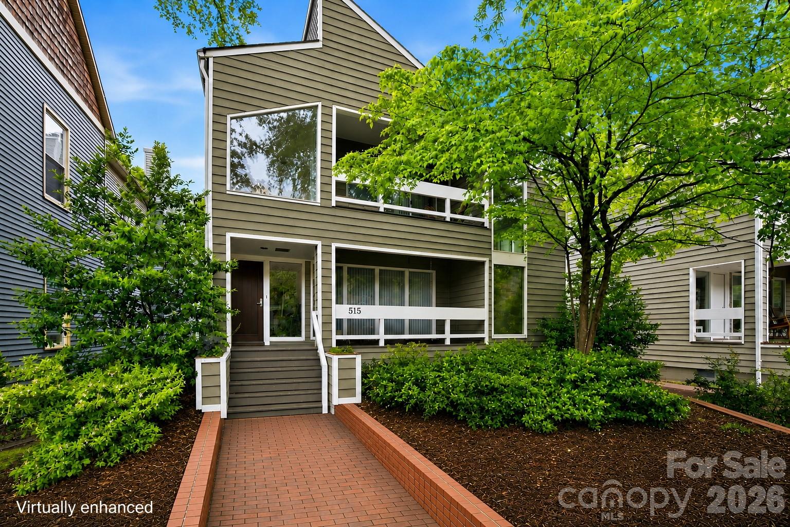 Located in Charlotte’s historic Fourth Ward, this architecturally distinctive residence blends timeless character, sophisticated design, and the convenience of premier Uptown living. Filled with natural light from expansive windows and soaring interior spaces, the home offers an inviting atmosphere that feels both grand and comfortable.

Designed for effortless entertaining and everyday living, the spacious main living and dining areas flow seamlessly together while showcasing the home’s unique architectural details. Just off the main living space, a private office/library creates the perfect retreat for reading, working from home, or quiet reflection.

At the heart of the home, the thoughtfully designed kitchen offers abundant cabinetry, generous workspace, and ideal connectivity to surrounding gathering areas—perfect for both intimate evenings and large-scale entertaining.

The expansive lower level is an entertainer’s dream, complete with a built-in bar and flexible recreation space ideal for hosting guests, movie nights, game days, or additional lounge and media areas. The spacious design extends naturally to a private courtyard, offering a seamless connection between indoor comfort and outdoor living that is ideal for entertaining or quiet relaxation.

The primary suite serves as a true private retreat, featuring an expansive sitting area with a cozy gas log fireplace, a spacious dressing area, and a personal sauna that creates a spa-like experience within the comfort of home.

Outdoor living is equally exceptional, with an expansive front porch, two upper level balconies, a side deck, and private rear courtyard creating multiple inviting spaces for entertaining, dining, and relaxation. Beyond the courtyard, the grounds are anchored by a rare in-town tennis court—an extraordinary amenity seldom found in the heart of Charlotte.

Positioned moments from Fourth Ward Park, Uptown dining, entertainment, cultural venues, and Charlotte’s major business districts, this residence offers unmatched accessibility while preserving the charm and character of one of the city’s most established neighborhoods.

An additional opportunity exists to purchase the neighboring property at 517 N. Poplar in conjunction with this residence, creating exceptional potential for expanded living, guest accommodations, multi-generational living, or investment opportunities.

A rare offering in one of Charlotte’s most desirable historic neighborhoods, this remarkable home combines architectural significance, refined entertaining spaces, exceptional amenities, and elevated city living.

Sellers prefer to sell both residences together with a combined offering price of $3.5 million.