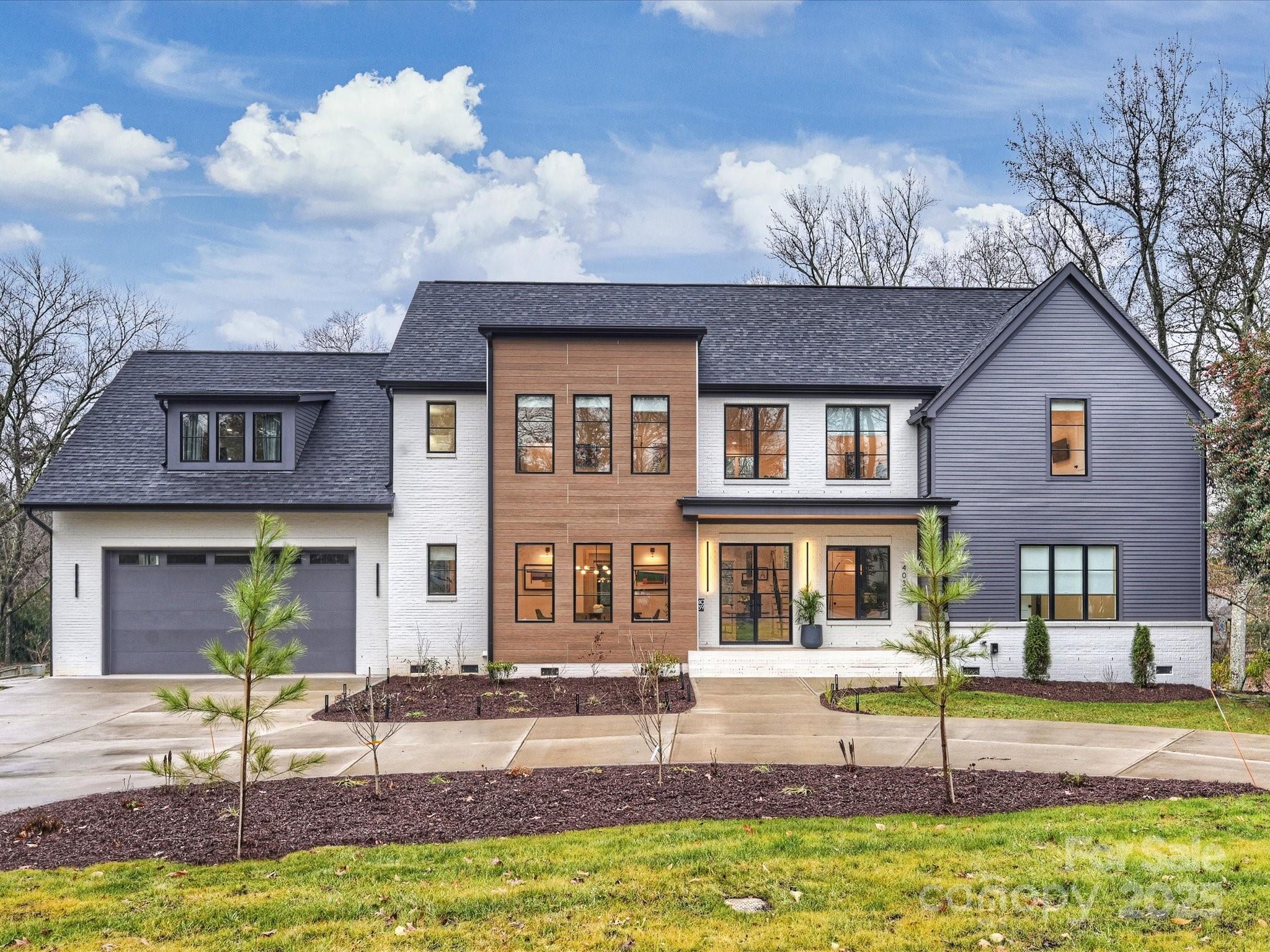 Stunning custom home built by Keen Builders featuring beautiful architectural details & modern finishes throughout. Sitting on approx. 1 ACRE this thoughtfully designed property offers high-end finishes & cutting-edge architecture in one of Charlotte’s most sought-after neighborhoods. At just under 5,000 sq ft this 5 bed/5.5 bath property blends contemporary elegance w/functional luxury. Enter into the impressive 2-story foyer that leads you into the open concept floor plan w/soaring ceilings & gorgeous natural light. Gourmet kitchen featured in QC Magazine offers custom cabinetry, an expansive island, Wolf range & double ovens. Primary suite on main w/ensuite spa-like bathroom. Secondary bedrooms offer custom closet systems & ensuite baths. Additionally home features formal dining, wet bar, study, 800 bottle wine room, add'l loft/flex space PLUS exercise/bonus room. Gorgeous screened porch boasts vaulted ceilings, fireplace w/ living & dining spaces, making it an entertainer's dream!