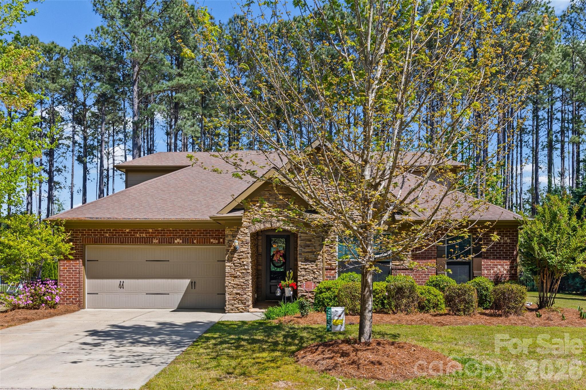 Welcome to this beautifully maintained 5-bedroom, 3.5-bath home offering the perfect blend of comfort, style, and practicality. Situated on a spacious .55-acre lot, this home features an open floor plan and thoughtful design throughout.  The main level includes a private office with a trey ceiling and elegant crown molding in the foyer. The primary suite, also on the main floor, boasts a trey ceiling, a spacious walk-in closet with direct access to the laundry room, and a luxurious en-suite bath complete with a garden tub, double sinks, and abundant storage. Two additional bedrooms on the main level each offer large walk-in closets.  The gourmet kitchen is a chef’s dream, featuring granite countertops, a large island with sink, gas stove with exhaust, stainless steel appliances, and a generous walk-in pantry. Enjoy meals in the bright dining area filled with natural light. Convenience continues with a mudroom/drop zone and extra storage just off the garage, leading directly into the kitchen. Upstairs, you will find two additional bedrooms with walk-in closets and a full bath. One bedroom offers flexibility and can easily serve as a bonus or entertainment room. Step outside to relax on the back porch and patio overlooking a flat, private, fenced backyard with beautifully maintained landscaping. Additional highlights include: Fresh neutral paint inside and outside of the house, generous storage throughout, HVAC system replaced 2023. Washer, Dryer and Refrigerator negotiable with a good offer. Ring Doorbell will convey. This home offers comfort, elegance, and everyday practicality in a beautiful community setting. Clover Schools and zoned for the new Lake Wylie High School opening in the fall of 2026! Easy access to Lake Wylie, Rock Hill and York for shopping, restaurants and entertainment, and less than 2 miles from the Allison Creek Waterfront Park with boat ramps, a fishing pier, walking trails, campsites, and more! Don't miss this opportunity to make this home yours!