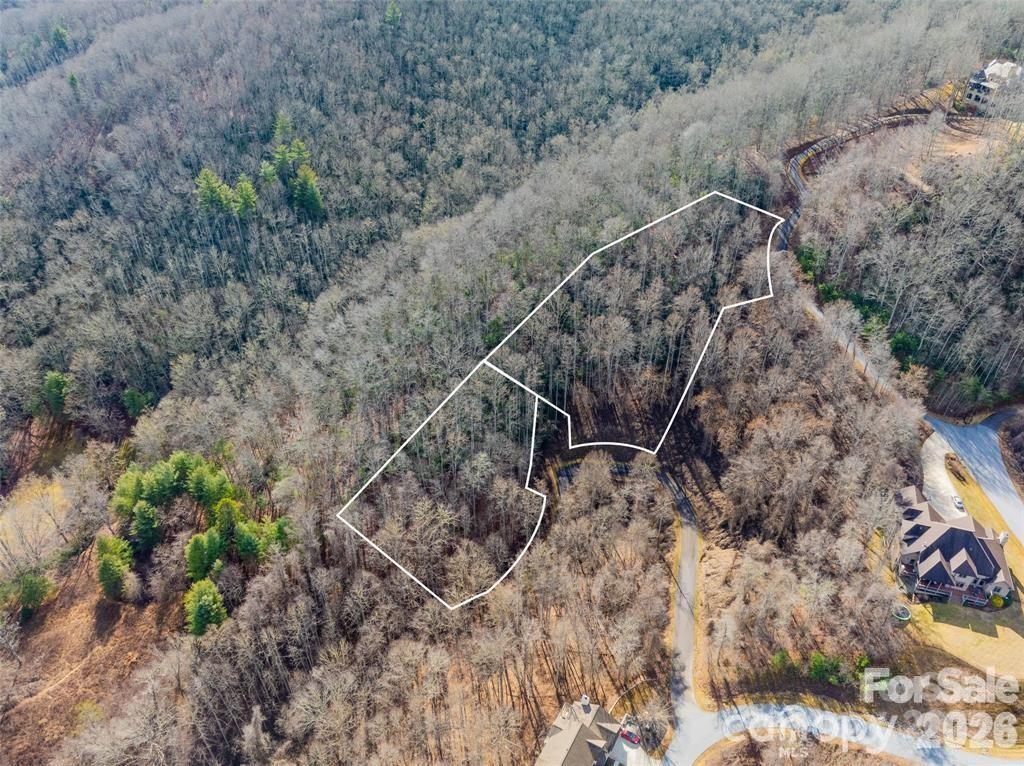 Two lots for the price of one in this gated mountain community! Enjoy some of the prettiest scenery around as you drive past horse farms cloaked by mountain views to the gates of the private Monarch Estates. Conveniently located in the Cane Creek Valley, 25 minutes to downtown Asheville, 25 minutes to downtown Hendersonville. Pristine cul-de-sac location with multiple build sites including winter views. Priced below tax value, come check it out and imagine the possibilities!