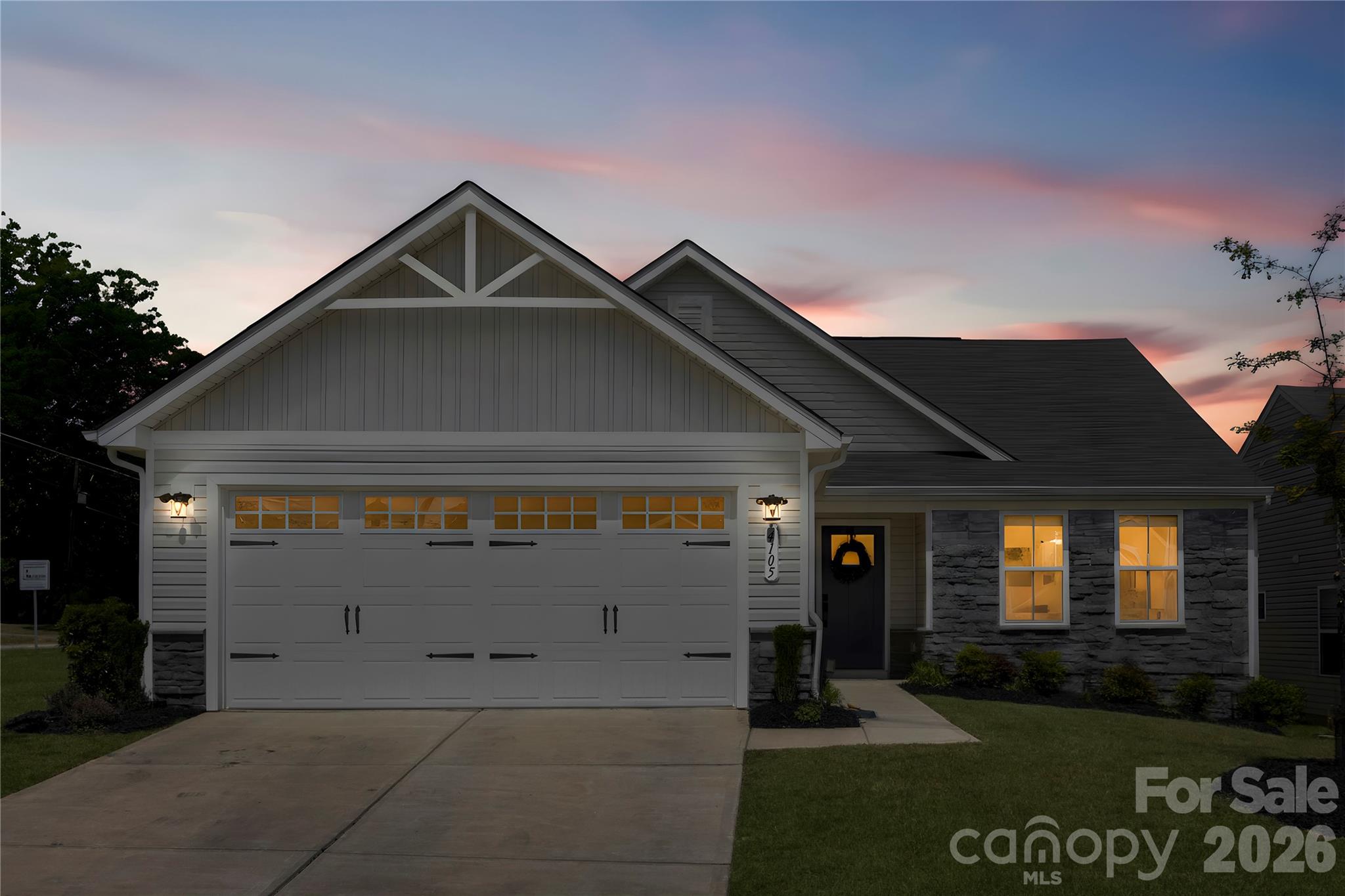 THE ULTIMATE SWEET SPOT IN WOODGROVE! Why settle for the smaller 1,340 SQFT models in the neighborhood, or pay $410,000+ and wait 6+ months for new construction? Get the BEST of both worlds TODAY: 1,545 SQFT of immaculate, upgraded 2022 ranch living on a premium corner lot—priced at a massive savings compared to building new!

To make this an unbeatable deal, the sellers are offering a $5,000 Credit to buy down your rate or cover closing costs! PLUS, ask how qualified buyers can tap into exclusive regional financing featuring 100% FINANCING / NO-DOWN-PAYMENT OPTIONS and NO MONTHLY MORTGAGE INSURANCE (NO PMI)!

This is true low-maintenance living—THE HOA HANDLES ALL LAWN CARE, giving you a corner yard with zero weekend chores. Perfect for busy Professionals, First-Time Buyers, or Downsizers who want maximum space without the upkeep.

Inside, this bright, sun-drenched home features durable luxury vinyl plank flooring throughout the main areas (no carpet where it matters most!). The center-island kitchen boasts timeless white cabinetry and stainless steel appliances, perfect for entertaining. The primary suite is a true retreat featuring a custom-designed walk-in closet system, with a secondary bedroom matching the custom upgrade!

WHY THIS HOME WINS:
• MORE SPACE: 1,545 SQFT of open-concept living (significantly larger than nearby resales!)
• BETTER PRICE: Save tens of thousands compared to the community's $410K+ base new construction prices.
• PREMIUM LOT: Corner lot with fully maintained HOA landscaping & 2-car garage.
• LOCATION: Quick commuter access, minutes to Charlotte's fastest-growing shopping & dining hubs.

Upgraded, spacious ranch homes under $380K do not last. Beat the new construction prices and the smaller competition—schedule your showing today!