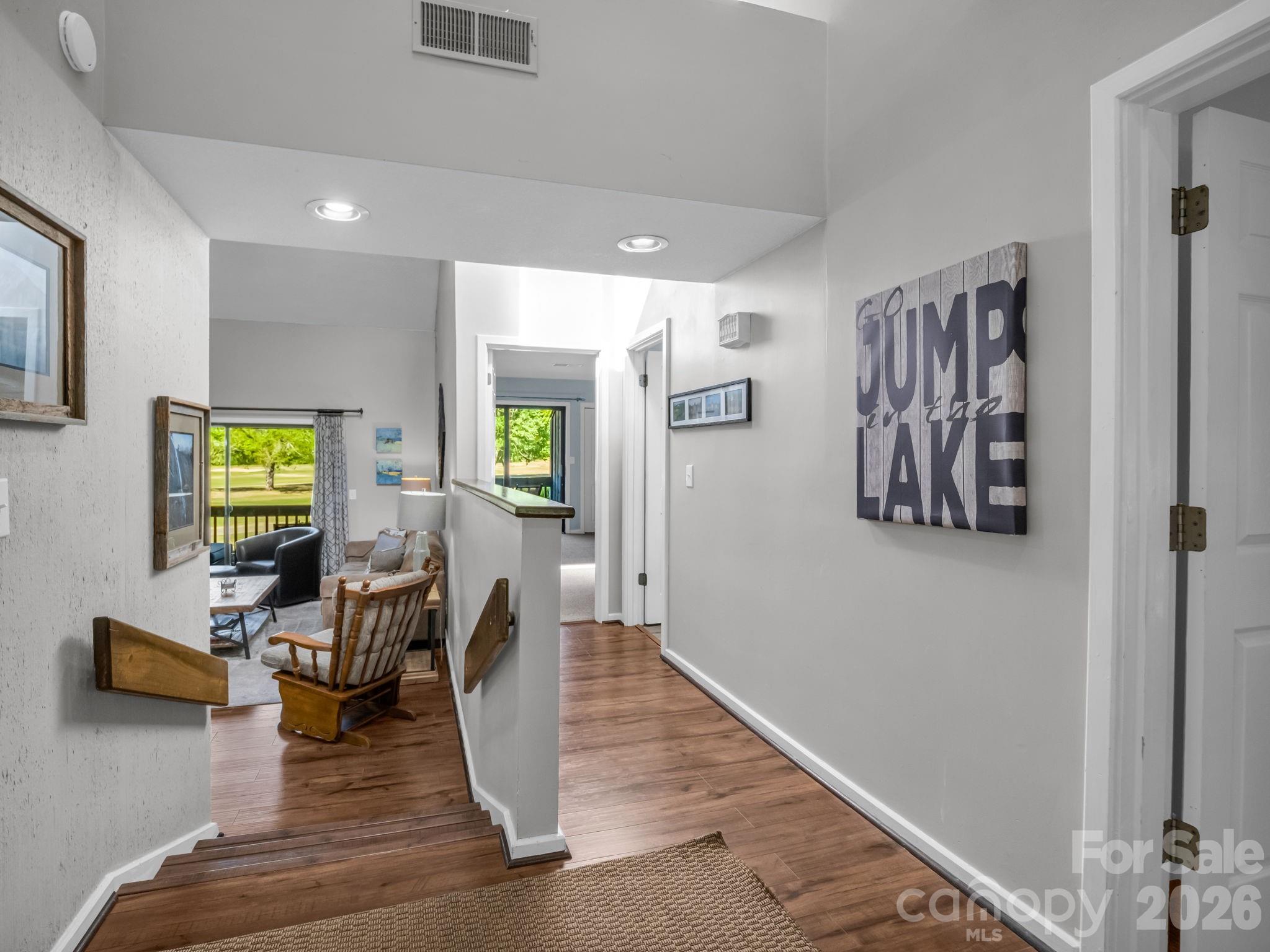 Lake Lure Investment Opportunity! Perfectly positioned along The Bald Mountain Golf Course, Unit 1403 offers breathtaking Mountain & Fairway views! Start your mornings on the private back balcony with coffee in hand, watching golfers drift by, and end your days soaking in stunning sunsets over the Fairway. This thoughtfully furnished, turn-key condo invites you in with warmth and character, featuring a charming loft very unique for a cozy hideaway or additional storage space. Stunning artwork from a local artists add an authentic touch to the overall decor. Located within the gates of Rumbling Bald on Lake Lure, this unit is within walking distance to Bald Mountain Lake & paddle board launch site. Hop on your golf cart and be minutes away from resort amenities, dining, and everything Rumbling Bald has to offer! Convenient to Tryon International Equestrian Center, Hendersonville, Asheville & Black Mountain.
