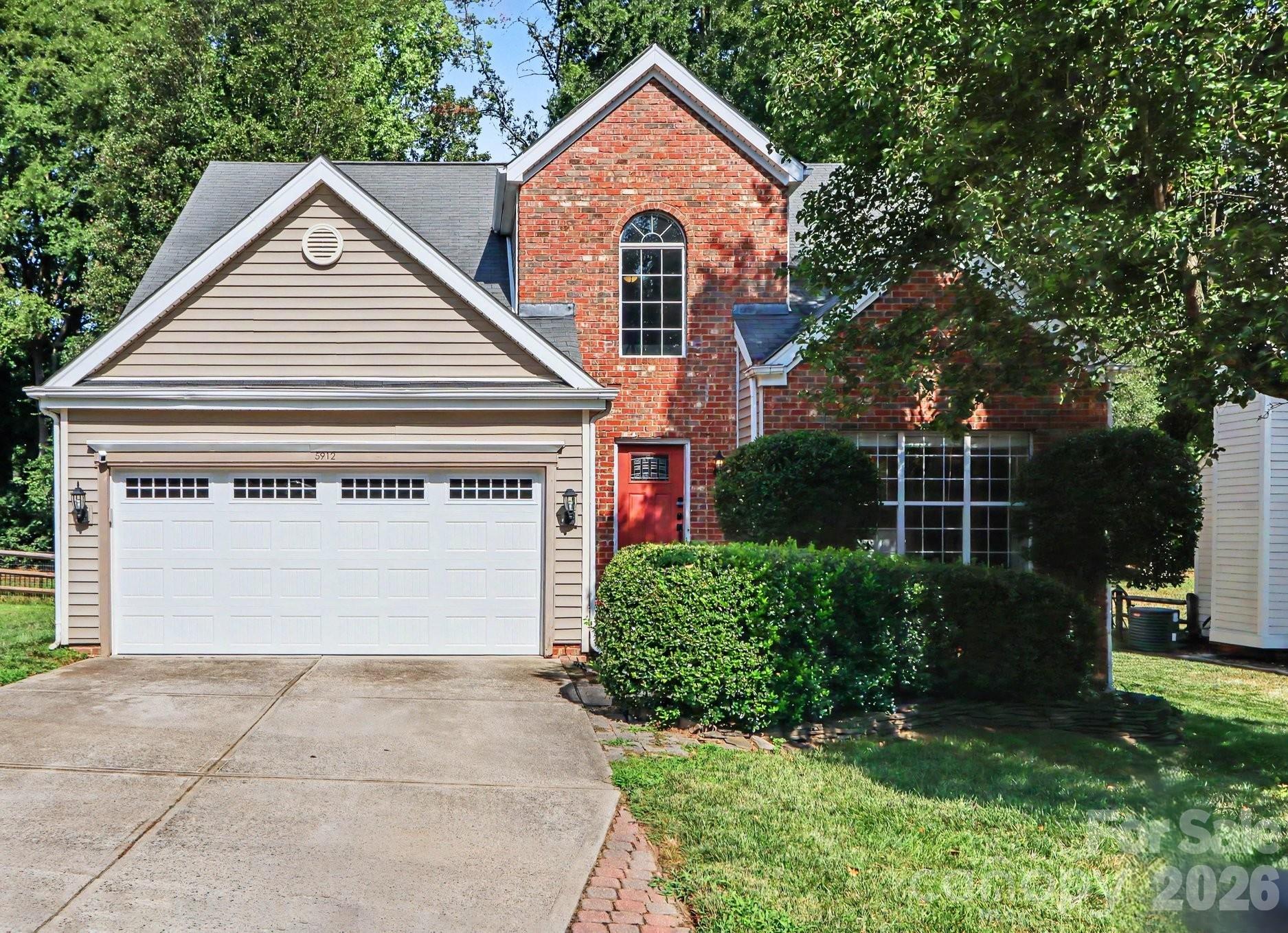 Welcome to this lovely home in the highly desirable Highland Creek community, where timeless charm meets modern comfort. This 3-bedroom, 2.5-bath home features a highly sought-after main-level primary suite, making everyday living both comfortable and convenient. The home sits on a nicely landscaped lot with mature trees and inviting outdoor living spaces, including a covered screened porch overlooking the fenced rear yard, perfect for morning coffee or evening gatherings. Step inside to soaring vaulted ceilings, abundant natural light, and an open, inviting floor plan anchored by a dramatic two-story great room with a cozy fireplace. The updated kitchen showcases granite countertops, white cabinetry with soft-close convenience, a center island, black stainless steel appliances, and ample workspace—perfect for preparing meals or entertaining guests. The spacious first-floor primary retreat/owner's suite offers a beautifully renovated en-suite bath featuring a tiled walk-in shower, dual vanity, and generous walk-in closet. Upstairs, two roomy additional bedrooms and a full bath provide flexible space for friends, guests, or a home office. And you will love the walk-in attic storage as well. Living in Highland Creek means enjoying one of Charlotte's premier master-planned communities, complete with multiple swimming pools, an award-winning golf course, clubhouse, tennis and pickleball courts, playgrounds, scenic walking trails, and year-round neighborhood events. Conveniently located near I-485 and I-85, the home offers quick access to Uptown Charlotte, Concord Mills, Charlotte Douglas International Airport, shopping, dining, and everyday conveniences. Sellers are willing to offer an appropriate allowance for 2nd floor carpet with an acceptable offer.