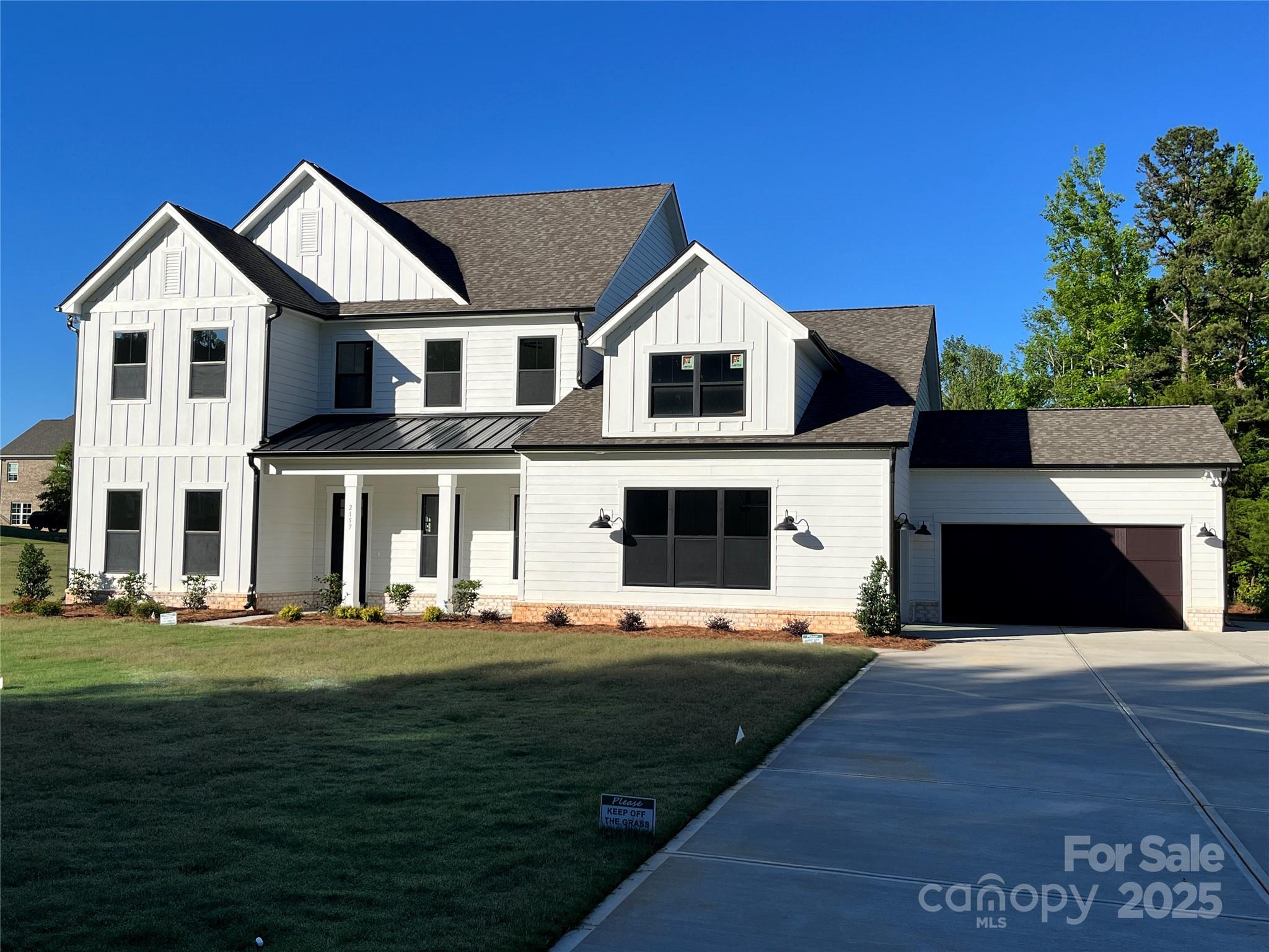Modern Farmhouse Luxury Home at Bretagne in Fort Mill!  Great location, low taxes, with convenience to schools, shopping, and restaurants - close to Ballantyne and just 30 mins to Uptown Charlotte! The Hampton offers 4000+SF and unsurpassed amenities! Spacious main level primary suite & luxe bath with designer tile, freestanding tub, large shower, double vanity, water closet & a huge walk-in closet!  Gourmet KT with 48" double oven gas range, quartz counters, oversized island, walk-in pantry; great rm with fireplace & panoramic 12' sliding glass doors lead to screened porch; the study, guest suite, drop zone and laundry complete the main level.  Upstairs, find 2 add'l bedrooms, 2 baths, plus storage, bonus room & flex room that could be your media room/fitness room/playroom.  Designer features thru-out - coffered ceilings, accent walls, LVP flooring & 10' ceilings w/8' doors on main level, craftsman style moldings, quartz counters in baths, upgraded lighting, plus much more!