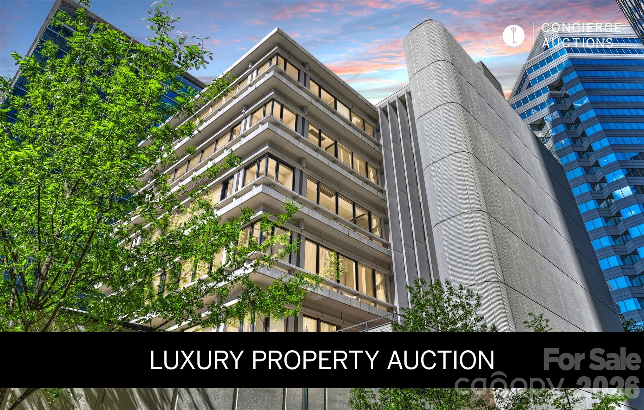 LUXURY PROPERTY AUCTION: 19–30 June.
Accepting starting bids through 18 June.
Starting bids expected between $1.75M–$2.75M.
Earn an incentive by 18 June.

The elevator opens directly into the residence, with no hallway, no neighbors,
and no preamble. This is the entire sixth floor of The Trust, and it moves with
the quiet authority of a space designed without compromise: Modernist bones,
custom finishes, marble and hardwood underfoot, a gas fireplace anchoring the
great room. The chef's kitchen is built for the serious host, and the 1,162-bottle
wine room ensures the cellar is always ready. A fitness area and home office
mean the day runs entirely on its own terms. Step outside onto either of the two
covered terraces and Uptown Charlotte delivers everything else: performing
arts, parks, dining, the energy of a city at full stride. And then the elevator
returns to a floor that belongs to no one else.