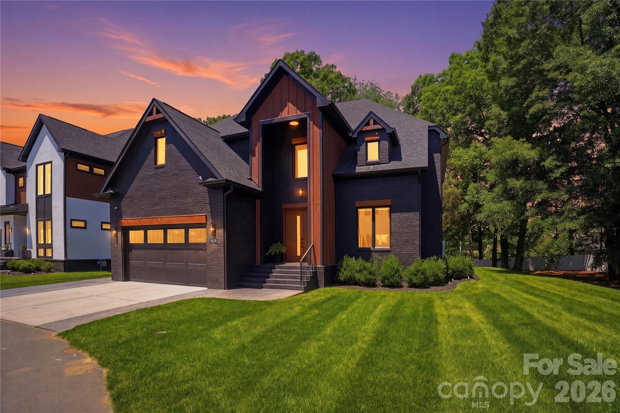 Stunning custom modern home in the heart of South Charlotte featuring designer finishes, soaring ceilings, and exceptional natural light throughout. This thoughtfully designed residence offers an open-concept floor plan with a dramatic two-story great room, floor-to-ceiling fireplace, expansive windows, and seamless indoor/outdoor living. The chef’s kitchen is equipped with custom cabinetry, oversized quartz island, premium stainless appliances, gas cooktop, double wall ovens, walk-in pantry, and designer lighting.

The luxurious main-level primary suite features a spa-inspired bath with freestanding soaking tub, oversized walk-in shower, dual vanities, and custom walk-in closet. Dedicated office with custom built-ins, spacious secondary bedrooms with en suite and Jack-and-Jill bath access, oversized bonus/playroom, and beautifully curated finishes throughout. Large laundry room with custom cabinetry and utility sink adds everyday convenience.

Outdoor living is equally impressive with an expansive covered deck, built-in grilling station, pergola, and private tree-lined backyard perfect for entertaining or relaxing year-round. Additional highlights include wide-plank flooring, custom millwork, dramatic ceiling details, modern black-framed windows, upgraded lighting throughout, and exceptional storage.

Located minutes from SouthPark, Carmel Country Club, premier dining, shopping, and top-rated schools, this exceptional home combines luxury, functionality, and modern elegance in one of Charlotte’s most desirable locations. Owner is a licensed Real Estate Agent.