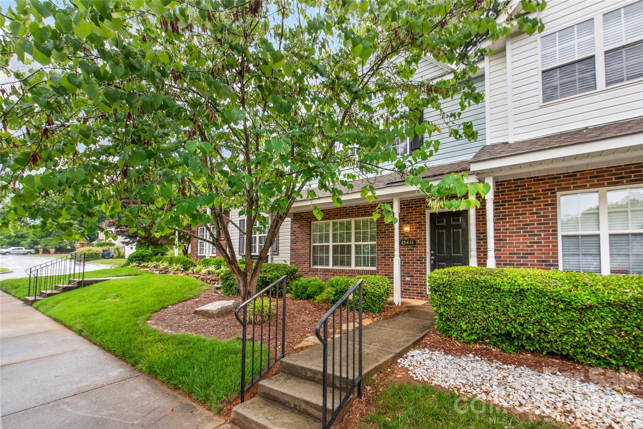 Experience the ultimate in low-maintenance living in the heart of Ballantyne! Perfectly positioned just minutes from the vibrant dining and entertainment at The Bowl at Ballantyne and the premier shopping at Stone Crest, this move-in-ready 2-bedroom, 2.5-bath townhouse offers comfort and convenience.

Inside, the main level is designed for effortless everyday living and entertaining. The desirable kitchen serves as the heart of the home, featuring a central island and beautifully updated flooring that flows through all the bathrooms. Transition seamlessly to the outdoors through updated sliding glass doors, which open to a private, wooded back patio...your own tranquil oasis for peaceful morning coffees or relaxing evening wine down.

Upstairs offers a dual-primary retreat, featuring two spacious bedrooms that each boast a private bathroom and a designated walk-in closet. A convenient main-floor half bath keeps guest spaces entirely separate.

Beyond the premier location and stylish finishes, enjoy total peace of mind with upgrades, including a newer roof, an updated HVAC and furnace (2018), and a personal whole-home water shut-off system. Best of all, the refrigerator, washer, and dryer all convey, allowing you to move right in and immediately start enjoying everything the Ballantyne experience has to offer.