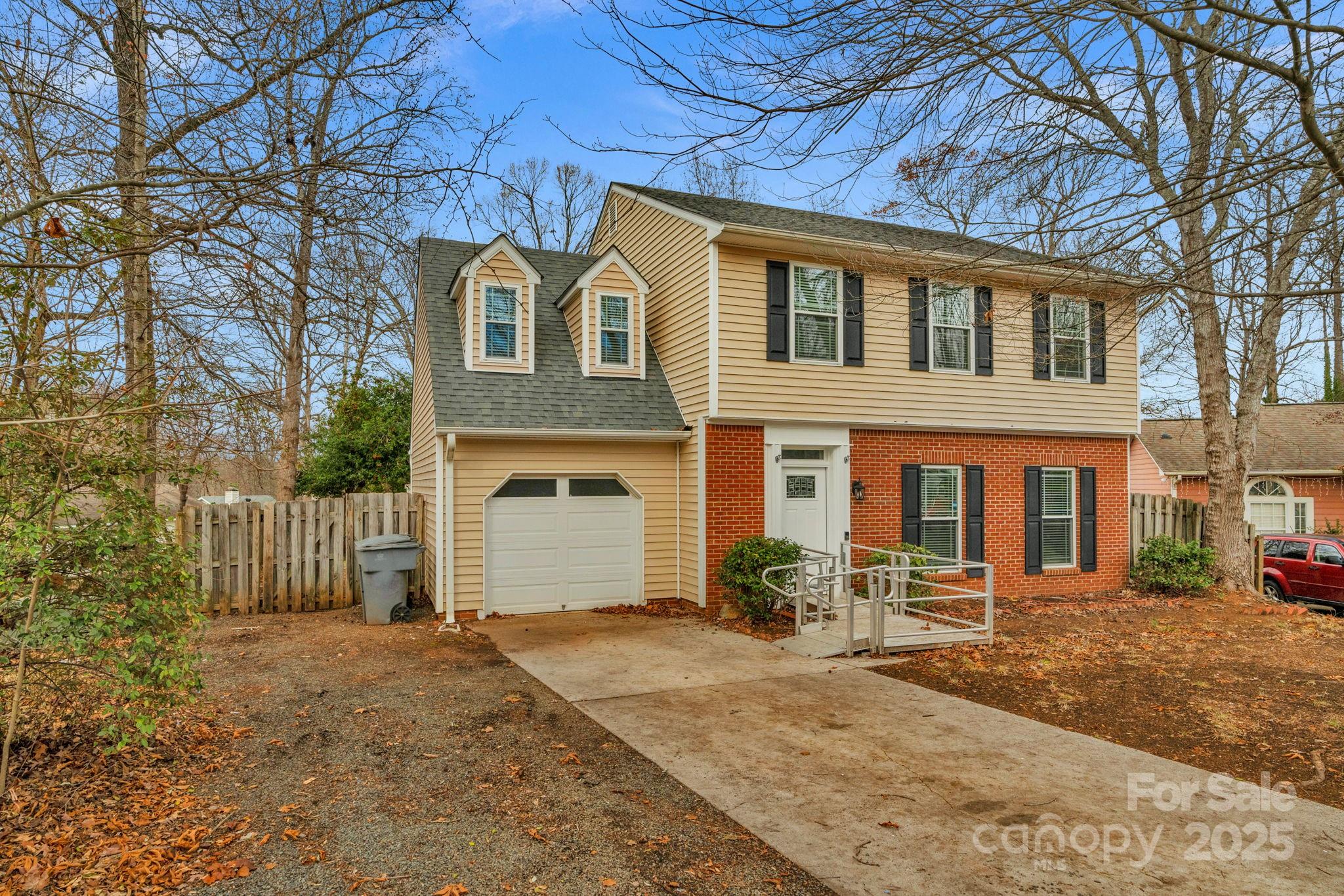 Welcome to this beautifully updated, move-in-ready home tucked away on a quiet cul-de-sac. The bright, open floor plan showcases an updated kitchen with granite countertops, a large center island, stainless steel appliances including a built-in microwave, and ample cabinet space—perfect for both cooking and entertaining. The expansive family room features a cozy wood-burning fireplace and opens seamlessly to the dining area. Upstairs, you’ll find updated bathrooms and a spacious primary suite with a private en-suite bath featuring a walk-in shower and soaking tub. Three additional guest bedrooms and a full guest bath complete the upper level. Outdoor living shines with a large deck ideal for entertaining, overlooking a fully fenced backyard with a storage shed. Conveniently located in the heart of Charlotte near shopping, dining, and everyday conveniences. One-car garage included.