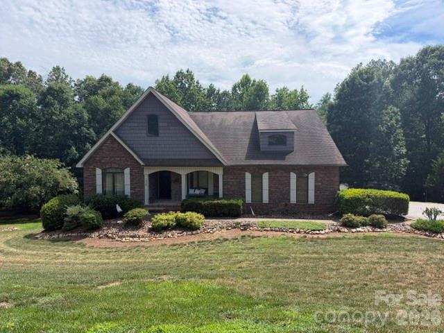 Beautiful, ranch home situated on 1.85 private acres in the desirable Brookstone community! Designed for easy, low-maintenance living, this exceptional home features hardwood floors, granite countertops, vaulted and tray ceilings, and an open-concept floor plan that showcases the stunning natural views. The spacious living area is highlighted by a beautiful stone gas-log fireplace, creating a warm and inviting atmosphere. The split-bedroom layout offers privacy, with two generously sized secondary bedrooms and a luxurious primary suite featuring a massive walk-in closet and an ensuite bath complete with dual vanities, a jetted soaking tub, and a tiled walk-in shower. The partially finished full basement expands the living space with a large den/media room, a full bathroom, and a flexible bonus space perfect for entertaining, a home office, or a recreation room. The unfinished area provides excellent storage and offers endless possibilities for future expansion. Outside, the oversized 1.85-acre lot features a peaceful running creek, creating a serene setting to enjoy from the screened porch or open patio. The backyard is made for relaxation and fun with an above-ground pool, hot tub, and a 25' x 25' detached building that's ideal for a workshop, hobby space, additional storage, or recreational equipment. Additional highlights include a two-car attached main-level garage, main-level laundry, and true one-level living with the added bonus of a spacious basement. This move-in-ready property offers the perfect blend of comfort, functionality, and outdoor enjoyment in a beautiful setting.