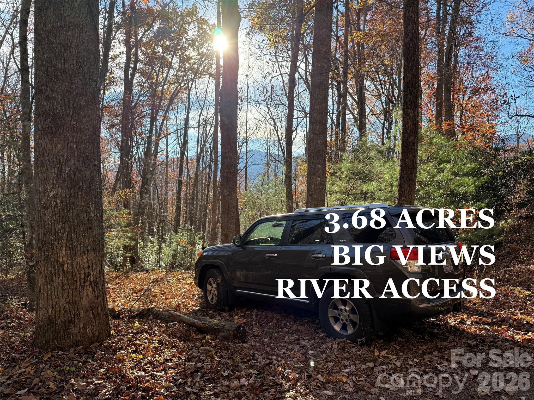 This property has it all! An insanely beautiful POA common area on the South Toe RIVER with great little trails...the PRIVACY of a magical mountain laurel, rhododendron, and hardwood forest...and extreme VIEWS of the Black Mountain Range with clearing!! Great usable land throughout---level to gently sloping with a small stream running along the southern boundary. Perfect location for the outdoor enthusiast. Imagine walking out your front door and taking a short stroll down to the river for some fly fishing, or just kicking back and soaking your feet. Abundant hiking trails are nearby and it is only a short drive to the Blue Ridge Parkway. Love art? Check out a Toe River Arts studio tour or head over to Penland School of Crafts for the day. Great shops, restaurants, and groceries are in the nearby towns of Burnsville and Spruce Pine. Minimal restrictions to protect your investment and super low HOA fee - currently $100 annually. This tract has a lot to offer at a great price - over $25k under tax value! Schedule a tour with your agent and get out to see this gem for yourself! Listing agent is related to seller.
