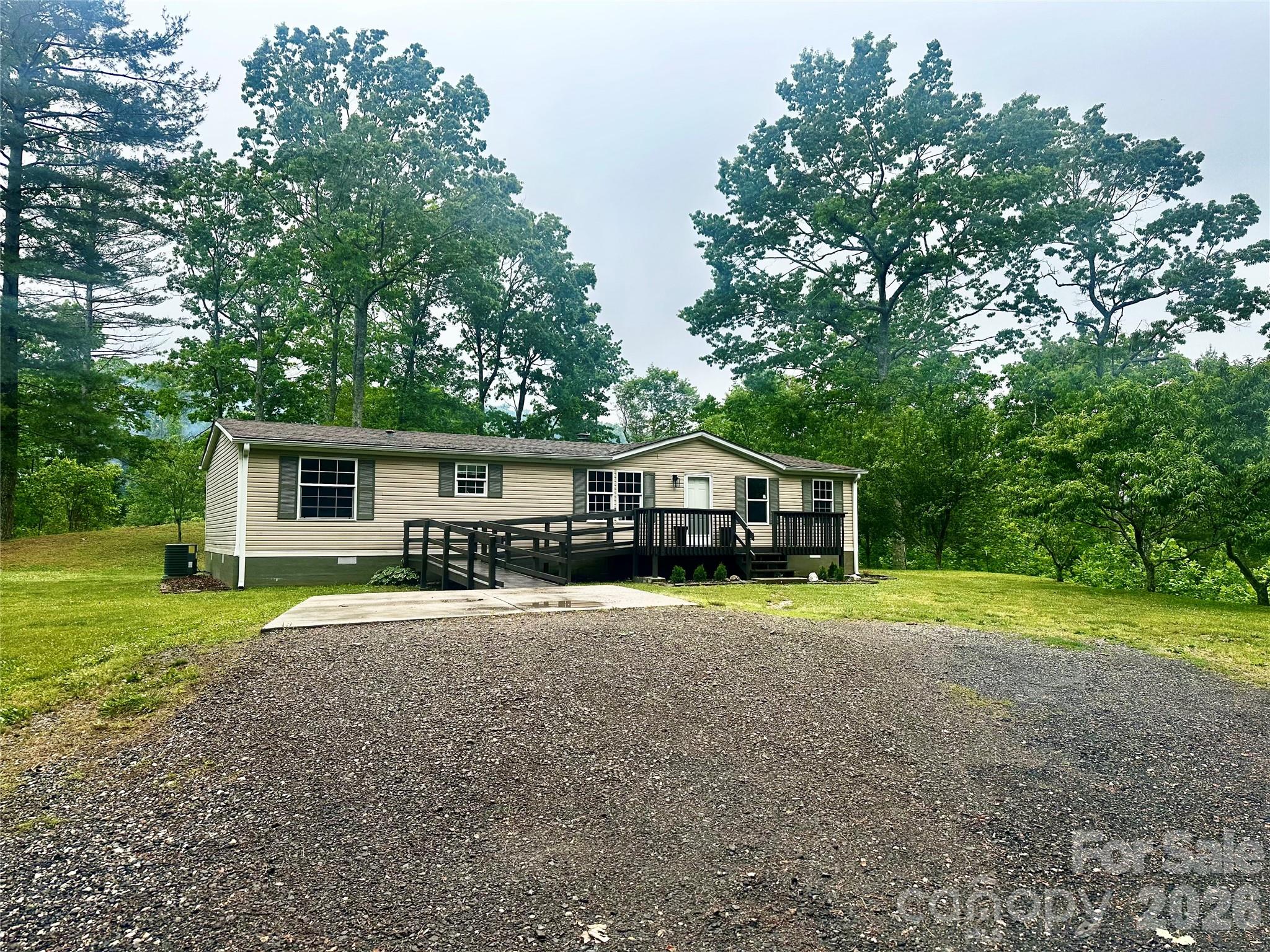 Discover peaceful country living in the heart of Western North Carolina with this well-kept 3 bedroom, 2 bathroom double-wide home situated on 2 beautiful acres. This property offers the perfect blend of privacy, space, and mountain charm—ideal for anyone looking to downsize, invest, or enjoy a quiet retreat.
Spacious 3BR / 2BA layout with an open-concept living area
Large kitchen with plenty of cabinet space and room to entertain
Primary suite featuring an en-suite bathroom
Two additional bedrooms perfect for family, guests, or a home office
2 usable acres offering room for gardening, animals, or future expansion.
large garage is perfect for a studio, workshop or just to park your cars.
Peaceful WNC setting with mountain views and easy access to nearby towns
Ideal full-time residence or rental investment
Enjoy the fresh mountain air, the quiet of country life, and the convenience of being just a short drive from amenities, outdoor recreation, and Blue Ridge attractions.