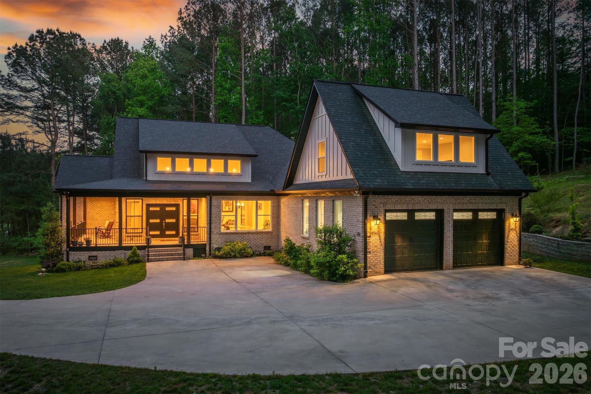 Welcome to this stunning custom built home in the prestigious Lake Hickory community of River Bend. Built in 2022 with quality 2x6 framing, this expansive 4 bedroom, 4 bath residence offers over 4,700 square feet of thoughtfully designed living space. Step inside to discover a bright, open-concept floor plan highlighted by a massive chef’s kitchen and a spacious living area centered around a sleek electric fireplace perfect for entertaining or enjoying everyday comfort. The main level features three bedrooms and three full baths, including a luxurious primary suite complete with a spa-like bathroom boasting a large walk-in shower, soaking tub, and an oversized walk-in closet. You’ll love the white oak hardwood floors and detailed ceilings throughout the home, giving it a distinctive, high end presence. Upstairs, you’ll find a massive bonus room currently used as a private guest suite, offering privacy from the main living areas. The finished walkout basement provides a wide open space ready to bring your vision to life whether it’s a game room, home theater, bar, golf simulator, or the ultimate entertaining zone. Mornings begin peacefully and evenings unwind effortlessly on the back porch, where privacy surrounds you and no homes are in sight. Set on 1.27 private acres, this property offers a rare blend of tranquility and convenience. Just minutes from local dining and shopping, and only a short 15 minute drive to downtown Hickory.