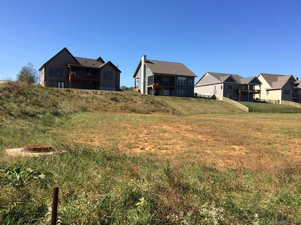 Corner lot in highly desirable location, centrally located between Asheville & Hendersonville, minutes to Airport Rd. amenities. Community with pool, clubhouse, stocked lake and sidewalks. Public water, sewer 7 gas.