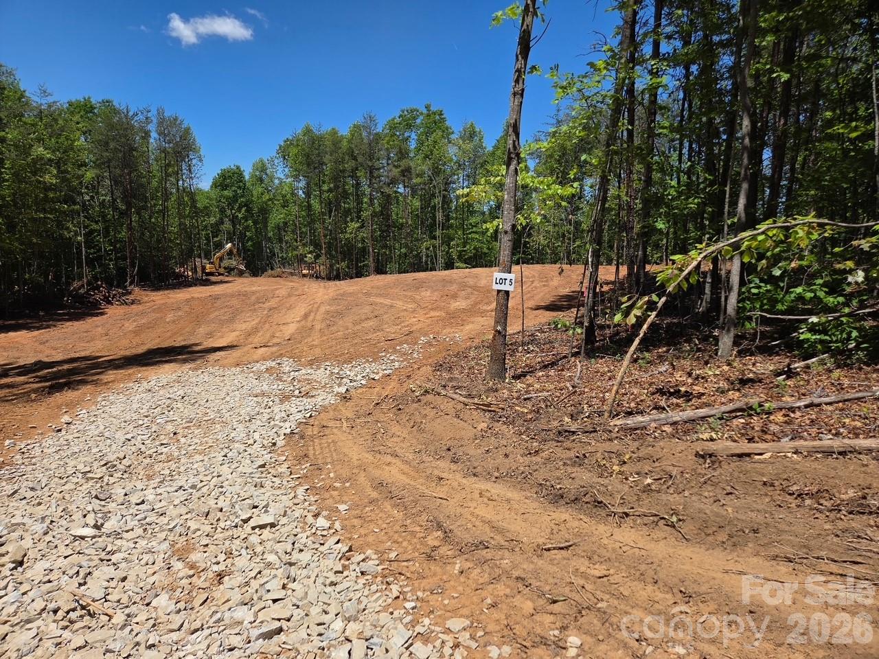 1.41 Acres Near I-40. Discover the perfect blend of privacy and convenience with this beautiful 1.40 acre lightly restricted property, ideally located just 9 miles from Interstate 40. Enjoy the freedom to build your dream home exactly the way you want. The land has already been partially cleared, and a gravel driveway is in place, making it easy to start your build right away. Whether you're planning a full-time residence, a vacation getaway, or an investment property, this parcel offers endless potential. And yes—legend has it there’s gold in these hills… they don’t call it Vein Mountain for nothing! Bring your house plans and turn your vision into reality. New mobile homes will be allowed. Adjoining land also available. Call listing agent for details.