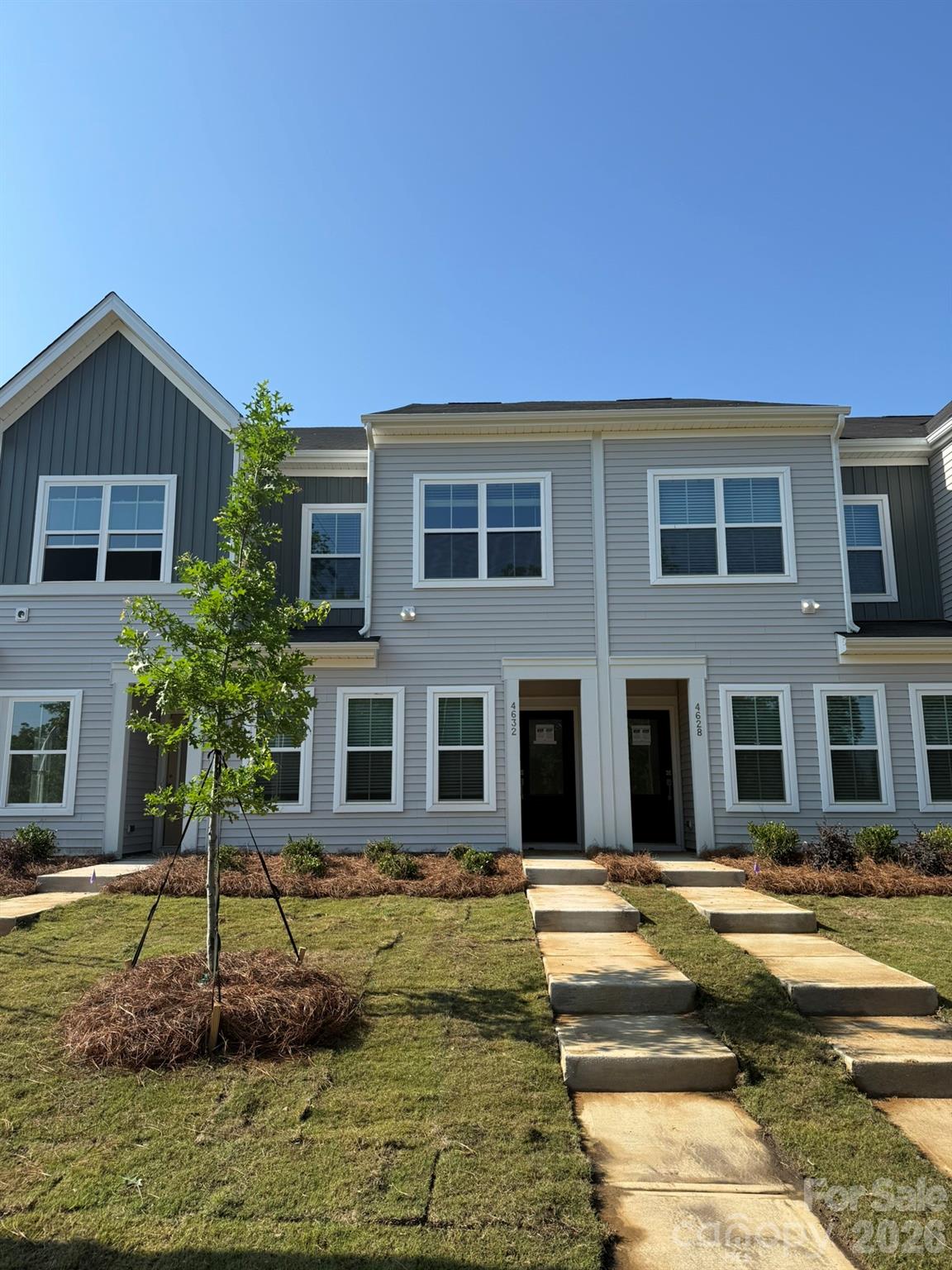 Discover the charm of this boutique townhome community built by Mungo Homes, a leader in quality craftsmanship & luxury design. This beautiful north-facing two-story townhome features 3 bedrooms, 2.5 baths, & a rear-entry one-car garage, double size driveway, offering an open-concept layout with stylish upgrades finishes throughout. The main floor boasts luxury vinyl plank flooring, creating a seamless flow through the bright & airy living spaces. The chef’s kitchen is a standout, featuring a large sitting island w/ Quartz countertop, Quill light brown stained cabinetry, tile backsplash, pendant lighting, & SS electric appliances! Upstairs, the spacious primary suite impresses w/ a 10' boxed ceiling, generous walk-in closet, & a en suite bath w/ a quartz-topped dual vanity & a tiled walk-in shower. Two additional bedrooms, a full bath, & a convenient laundry closet complete the second level. Located just minutes from Uptown Charlotte, the airport, & shopping, Lakeview Village offers the perfect blend of style, comfort, & convenience. Ask about Move-in package & Financing Promotions! 2025 Parade of Homes GOLD Winner!  Representative Photos Only - Home is under construction with completion estimated for June.