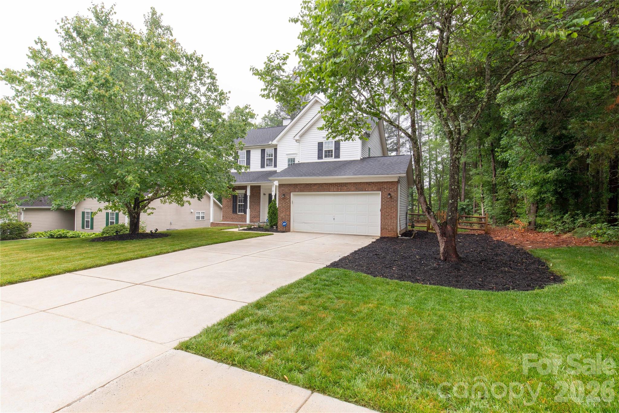 Welcome home to this Move-in ready retreat in the desirable Bradfield Farms community! This stunning two-story home features a bright, sun-drenched floor plan highlighted by a grand foyer, fresh neutral paint, and beautiful flooring. The spacious kitchen is a chef’s dream with brand-new granite countertops, abundant cabinetry, and new stainless steel appliances. Living room with fireplace with French door open to back deck. Upstairs boasts three bedrooms, including a massive primary suite with vaulted ceilings and a walk-in closet, plus a versatile large loft perfect for study/exercise/flex space. Arched details, moldings, and built-ins. Laundry on main, two car garage. Step outside to your private oasis— featuring a brand-new, massive deck in the serene backyard surrounded by wooded green space - perfect for relaxing and entertaining! Conveniently located near UNC Charlotte, Uptown, and top amenities like community pools and trails. Refrigerator, washer, dryer, and chandeliers all convey! Make your appointment to see this one today!