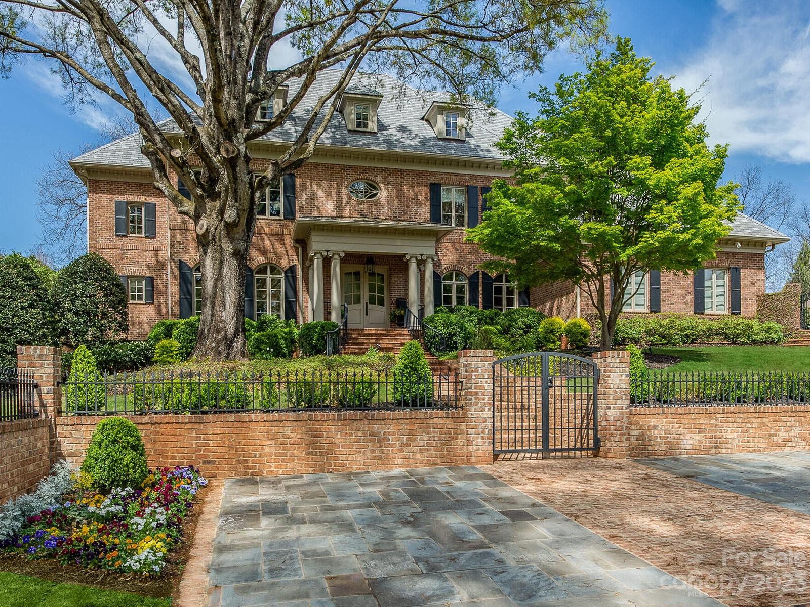Amazing Foxcroft location! Spectacular full brick home had extensive renovation in 2010 & additional updates in 2020 & 2021. Interior features a grand foyer w/ winding staircase, library, large formal areas & open floorplan including great room w/ stone fireplace & glass temp controlled wine wall. Additional sunroom w/ fireplace features walls of windows and 2 sets of accordion style doors that open to separate terraces to enjoy the outdoors. Gourmet kitchen oversized island, high end appliances opens to breakfast room w/ vaulted ceilings. Primary suite on main w/luxury bath (steam shower & heated floor), 2 large closets, & laundry rm. 4 ensuite bedrooms on second floor w/ game rm & theater. 3rd floor office has full bath & could be Guest Suite. Heated saltwater pool w/spa, pool bath & sauna. Private professionally landscaped rear lot & courtyard w/ gated entry for security. Detached climate controlled exercise rm could also be golf cart storage. Generator & Synthetic Slate Roof.