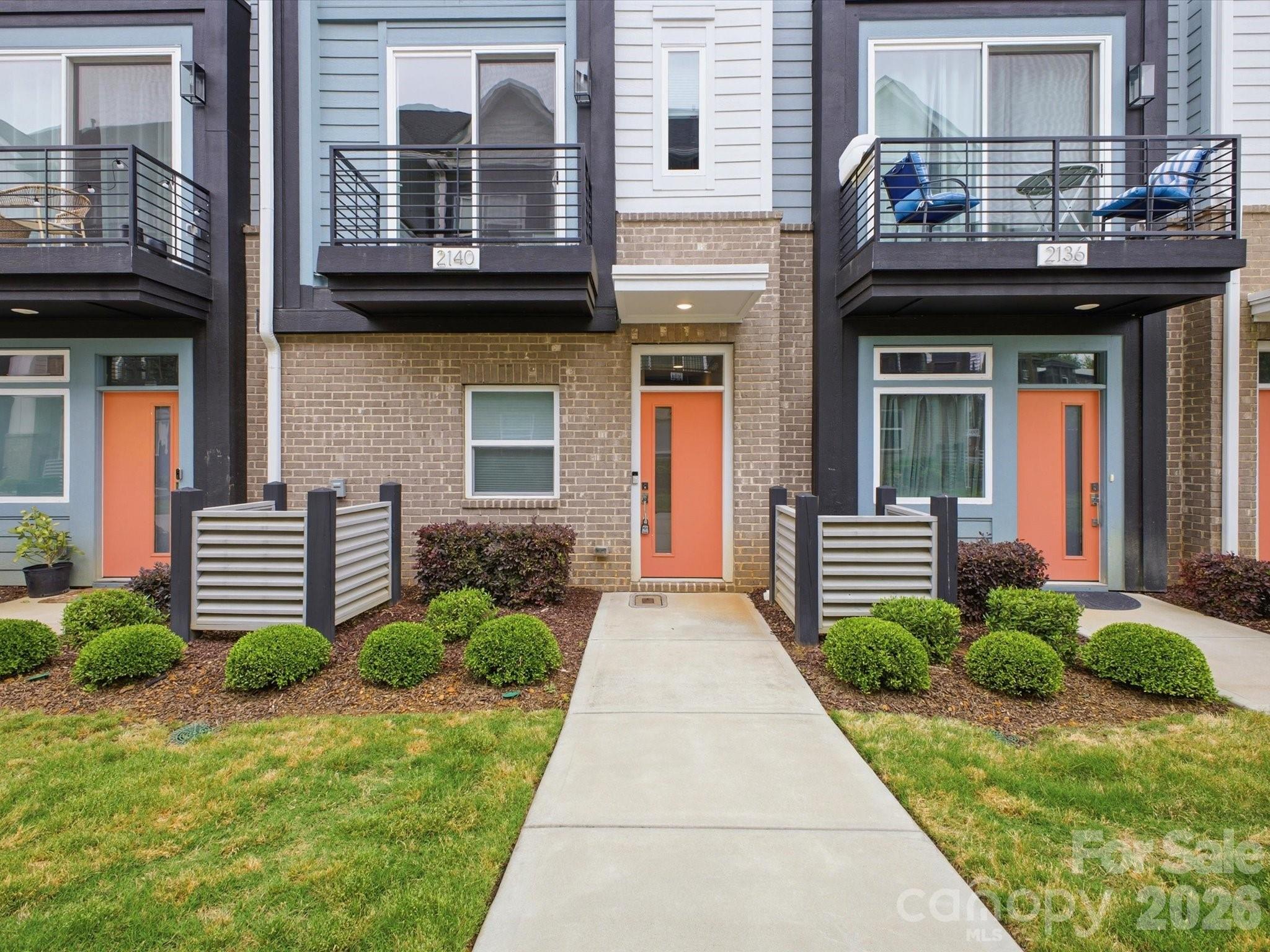 Seller offering opportunity for $5k Incentive to buy down your rate! Welcome to townhome living in the heart of NoDa, Charlotte's most vibrant arts and entertainment district. Tucked into the sought-after Landings at NoDa community, this 3-story contemporary townhome puts you within an easy walk of the LYNX Blue Line 36th Street Station, North Davidson Street's beloved breweries and restaurants, and the live music venues that make NoDa one of the most walkable neighborhoods in the city. Hop on the light rail and you're minutes from Uptown, Optimist Hall, and South End — leave the car at home. Guest parking spaces readily available throughout Landings at NoDa.
Built by Empire Communities in 2022, this 2-bedroom, 2.5-bath home lives larger than its square footage thanks to soaring 9-foot ceilings on every floor and an abundance of natural light. The main level is designed for entertaining, with an open-concept living and dining area that flows into a beautifully appointed kitchen featuring white shaker cabinetry, quartz countertops, GE stainless steel appliances, a large stainless sink, under-cabinet lighting, and a spacious center island. A convenient powder room completes the main floor.
Upstairs, the primary suite offers a walk-in closet and a spa-inspired bath with a raised quartz vanity and ceramic tile floors. A generously sized second bedroom, a second full bath, and an upper-level laundry room round out the third floor.
A rare find in NoDa: the attached tandem 2-car garage provides covered parking and bonus storage. The HOA handles lawn maintenance, so you can spend your weekends exploring the neighborhood instead of doing yard work. HOA also includes exterior maintenance, water, sewer, and trash. Sidewalks and street lights throughout the community make evening strolls to your favorite NoDa spots safe and easy.
Whether you're catching a show at The Neighborhood Theatre, grabbing brunch on 36th Street, or commuting Uptown via light rail, this home delivers the very best of NoDa living.