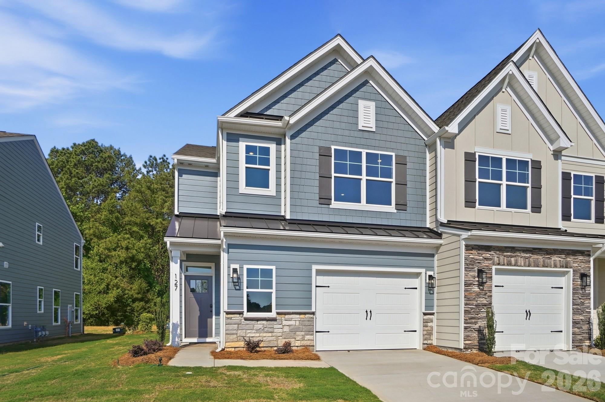 This end-unit townhome has 3 bedrooms, 2.5 baths, and an attached, expanded 1-car garage with a storage area. The garage entry with built-in drop zone leads into the open family room and kitchen. The kitchen features Shaker-style white cabinets, quartz counters, a tile backsplash, and stainless appliances, including a gas range. Beautiful and durable Enhanced Vinyl Plank flooring runs throughout the main level, and all baths feature white quartz counters & cabinets. The primary bedroom, located on the second floor, includes a large walk-in closet. The primary bathroom features a luxury, tiled shower with bench seat and semi-frameless door, two separate vanities, and a linen cabinet. The second floor also has two additional bedrooms, a full bath with tub/shower combo, a spacious loft, and the laundry room. Other extras include a tray ceiling in the foyer, Craftsman-style trim, and stairs with composite treads & metal balusters. Visit today!