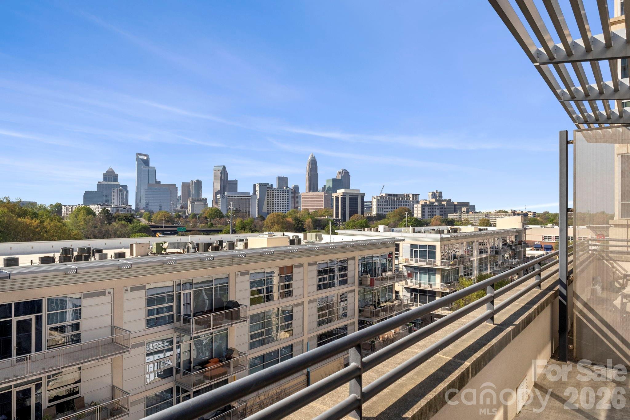 Welcome to Met Lofts at The Metropolitan! Where skyline views and walkable city living come together. This sixth-floor, two-level condo offers sweeping Uptown views and a bright, open layout. 
The main level features a spacious kitchen with abundant cabinetry, a dining area, comfortable living space, and a convenient powder room. Downstairs, you’ll find two well-appointed bedrooms—each with walk-in closets and private en-suite baths—plus a centrally located laundry closet for added convenience.  The primary bedroom has amazing uptown views just like the sitting area above.
Enjoy immediate access to dining and shopping right downstairs, along with premium amenities including covered parking (with a space near the entry), a dedicated storage unit, and a clubhouse featuring a pool, fitness center, grilling area, and ample seating. All this, Located right beside the 17+ mile Little Sugar Creek Greenway. 
Learn more: https://MetropolitanClt.com