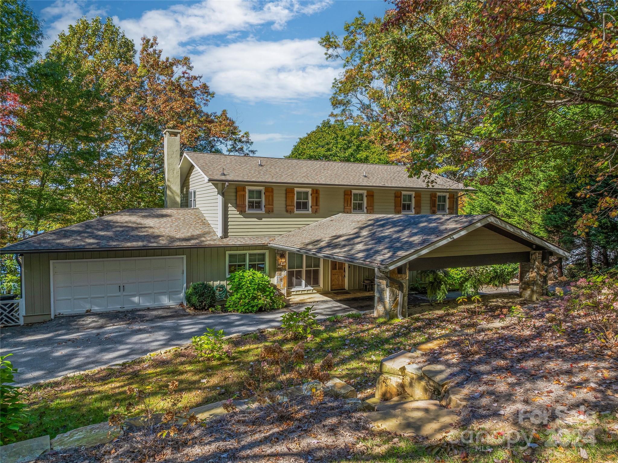Opportunities like this one are few and far between… a truly remarkable lakefront home on one of the most coveted streets in Lake Toxaway.  Not only does this home have amazing lake and mountain views year round, but handsome hardscaping on the grounds and an interior to envy with shiplap walls, custom window treatments, an updated kitchen and bathrooms along with many other details not to be missed!  Also worth noting there is a 2 car garage attached, a spacious carport and a generator that powers the entire house when needed.