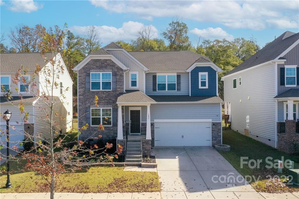 Loan assumption available!! Move in ready private lot home in desirable Waterside at the Catawba neighborhood! This 5 bedroom home includes a secondary primary bedroom suite on the main floor for guests. Enjoy the custom landscaping work, paver patio with built-in sitting area and back deck that backs to trees! Ideal floorplan with dedicated office space, open floorplan on main floor and huge secondary living room upstairs. Enjoy wood floors, fresh paint, granite counters and bright and airy feel! Enjoy all the amazing amenities this community has to offer including outdoor pool, tons of walking trails, fitness center, playground, clubhouse and new recreation area!