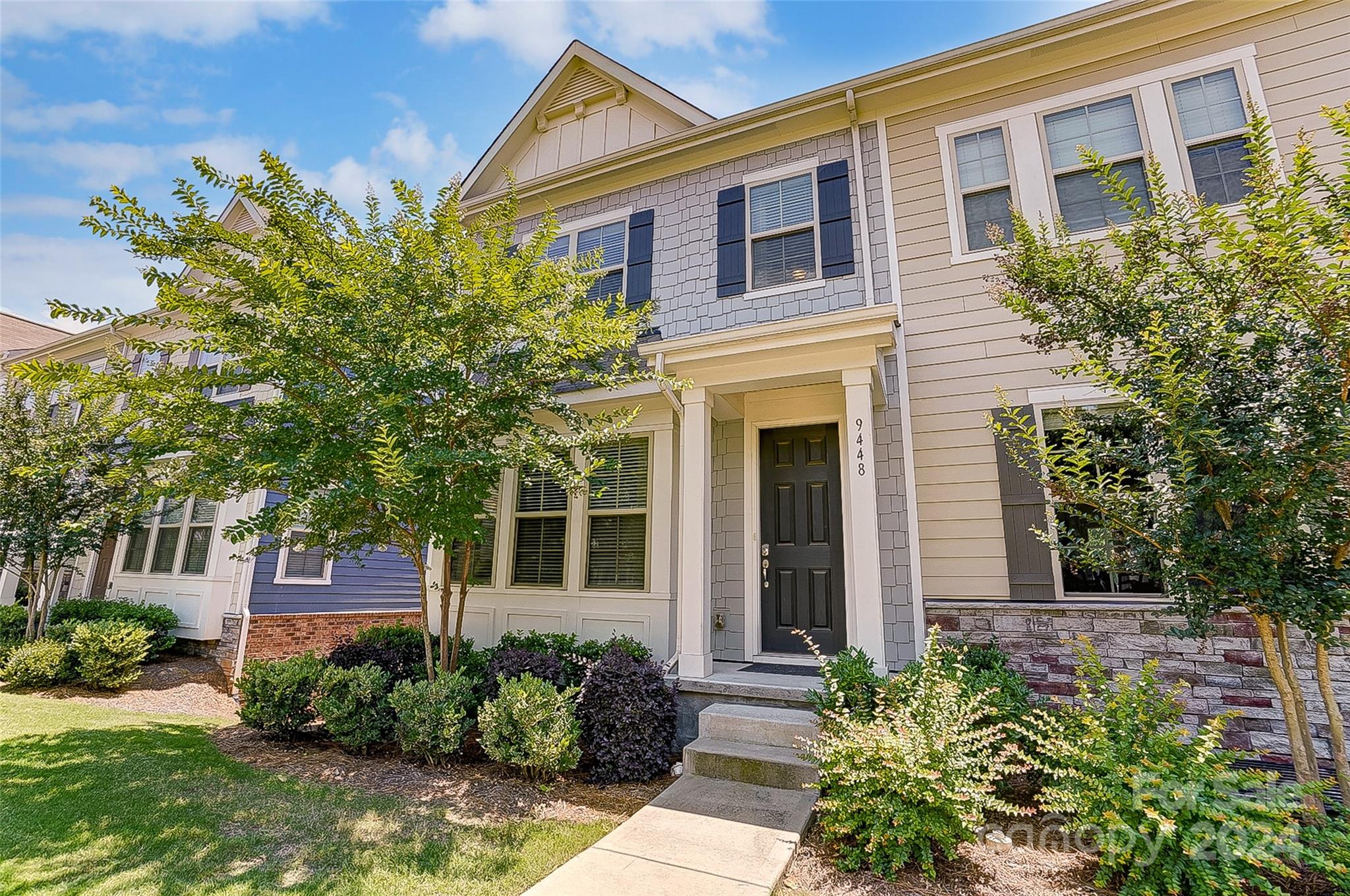 Beautiful end unit, lots of windows & natural light, modern open floor plan. Plenty of storage in the kitchen, huge sitting island, granite countertops, stainless steel appliances, upgraded gas range with double oven and walk in pantry. A large dining area and great room, powder room and balcony off the kitchen complete the main level. The upper level includes a spacious primary BR, with en suite bath and walk in closet, 2 guest BRs, full bath and laundry. The lower level has a rear entry 2 car garage, guest BR/office with full bath, and a private, wooded area behind the townhome. Nice community pool with cabana & grilling area are only a short walk. Extra parking conveniently located in the front for unloading groceries or packages, with only 2 steps onto the porch & in the front door to the main level. Enjoy all that Charlotte has to offer in this fantastic location near the Light Rail, the Airport, uptown Charlotte, SouthPark, Carolina Place, Prime Outlets, 77 & 485. Must See!