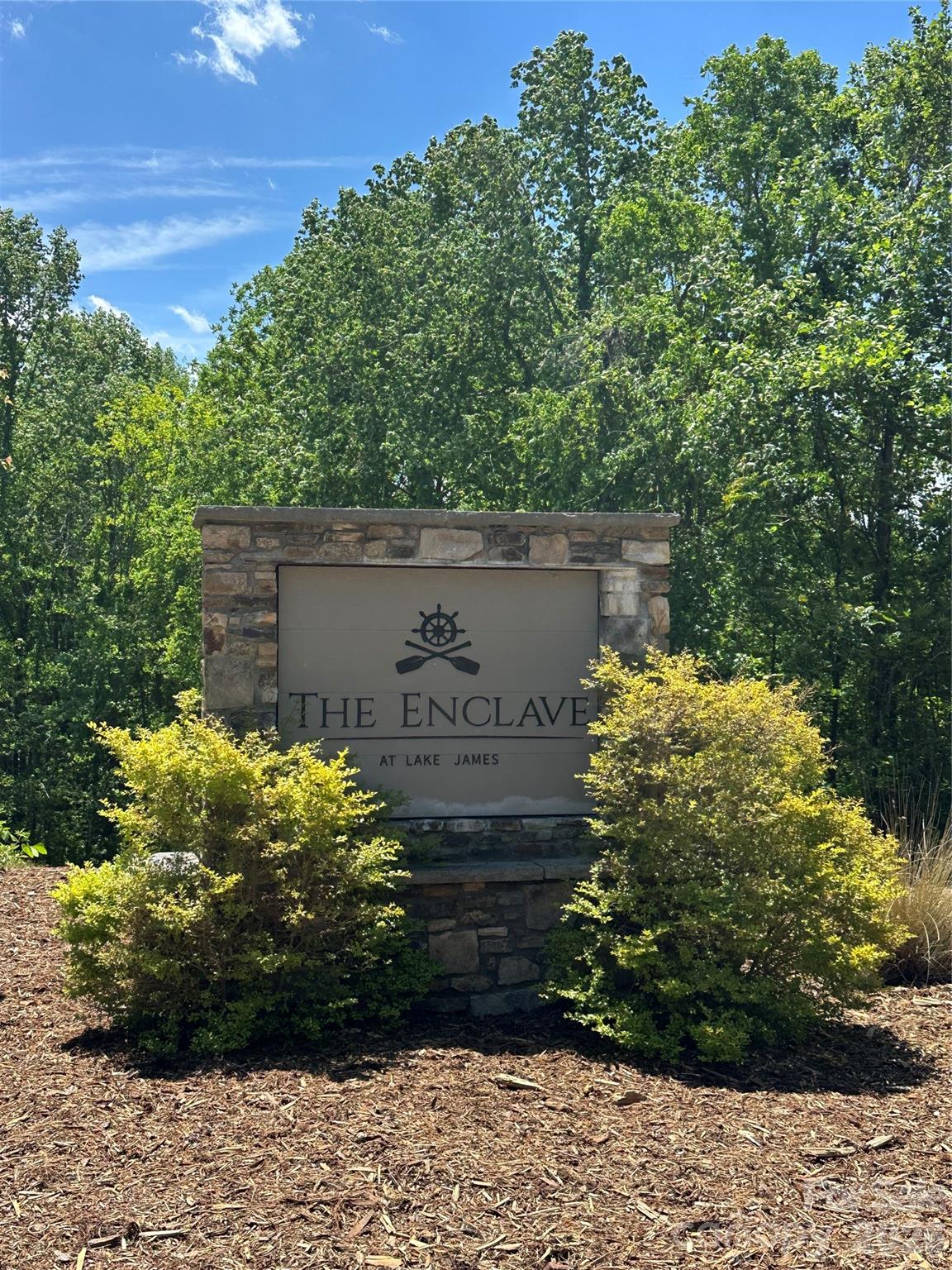 This beautiful, wooded 2.28-acre lot is located in The Enclave, an exclusive gated community on Lake James. Live in your camper or RV while building your dream home.

Residents enjoy access to community boat slips, a fire pit, and a picnic area. Outdoor lovers will appreciate the proximity to the Fonta Flora mountain biking trail, Linville Gorge Wilderness Area, Lake James State Park, and Shortoff Mountain, known for its stunning hiking views.

Conveniently situated between the charming towns of Marion and Morganton, you’ll have quick access to shops, restaurants, and everyday essentials. The property is also just one hour from Asheville, Boone, and Hickory, and about 1.5 hours from Charlotte.