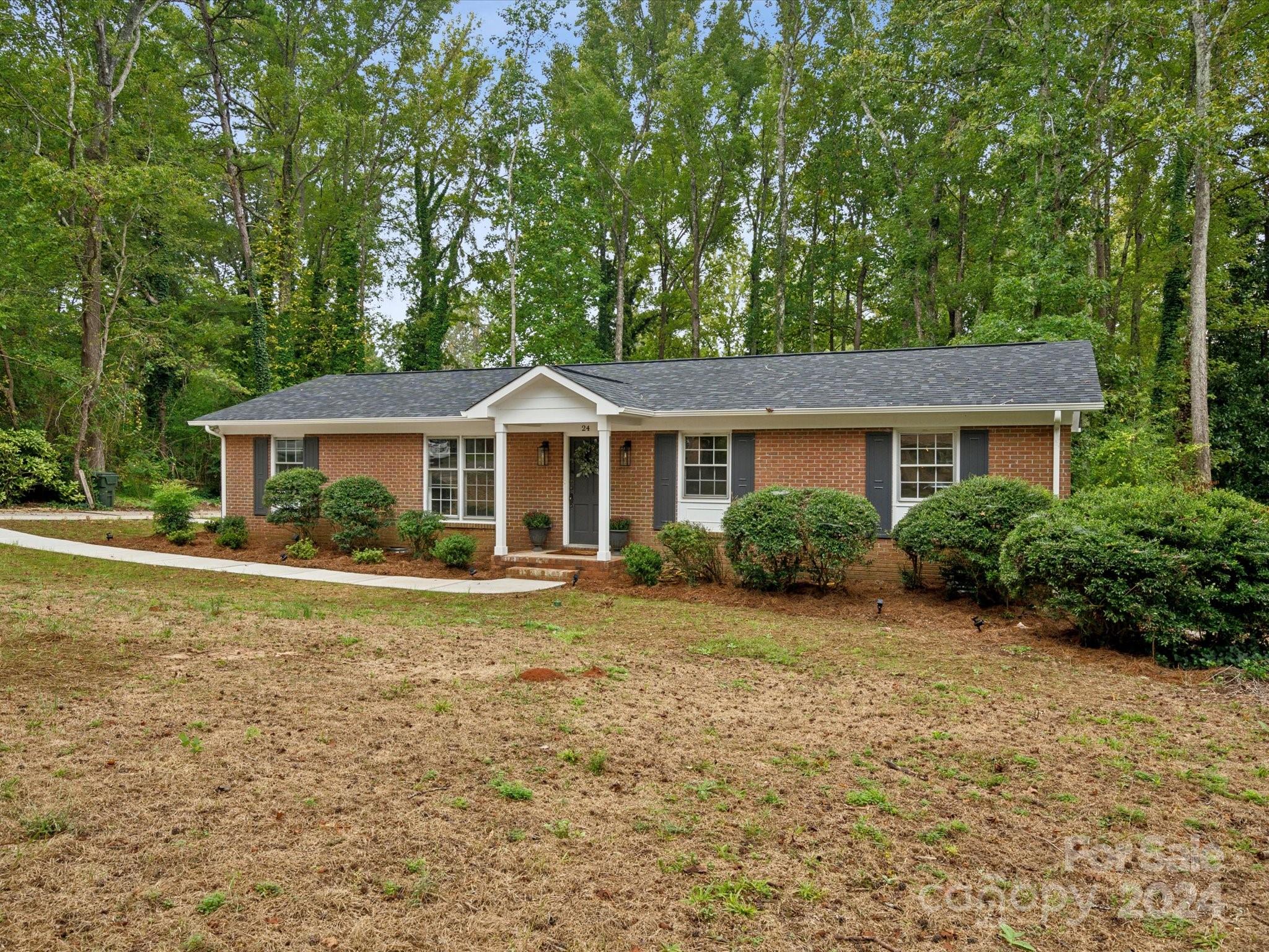 Restored and renewed, this jaw dropping renovation is ready for its new owner! The nostalgia of this classic brick ranch was preserved while adding in all today's modern conveniences! Recent renovations include all new plumbing, electrical, HVAC system, roof, cabinets, counters, appliances and lighting fixtures!  This beauty is situated on a established lot close to all historic York, SC has to offer! Across the threshold you will be in awe of the custom finishes in every room! The living room boasts a picturesque window overlooking the front yard, custom lighting and newly refinished hardwood floors! The kitchen is complete with tons of cabinetry, granite countertops and SS appliances! Just off the kitchen is a large laundry room and formal dining room!  Rest and relax in the primary suite complete with a primary bath featuring a walk in shower and custom vanity! 2 more bedrooms and a 2nd bath complete the interior! Beyond the glass you will find a serene backyard with storage sheds!