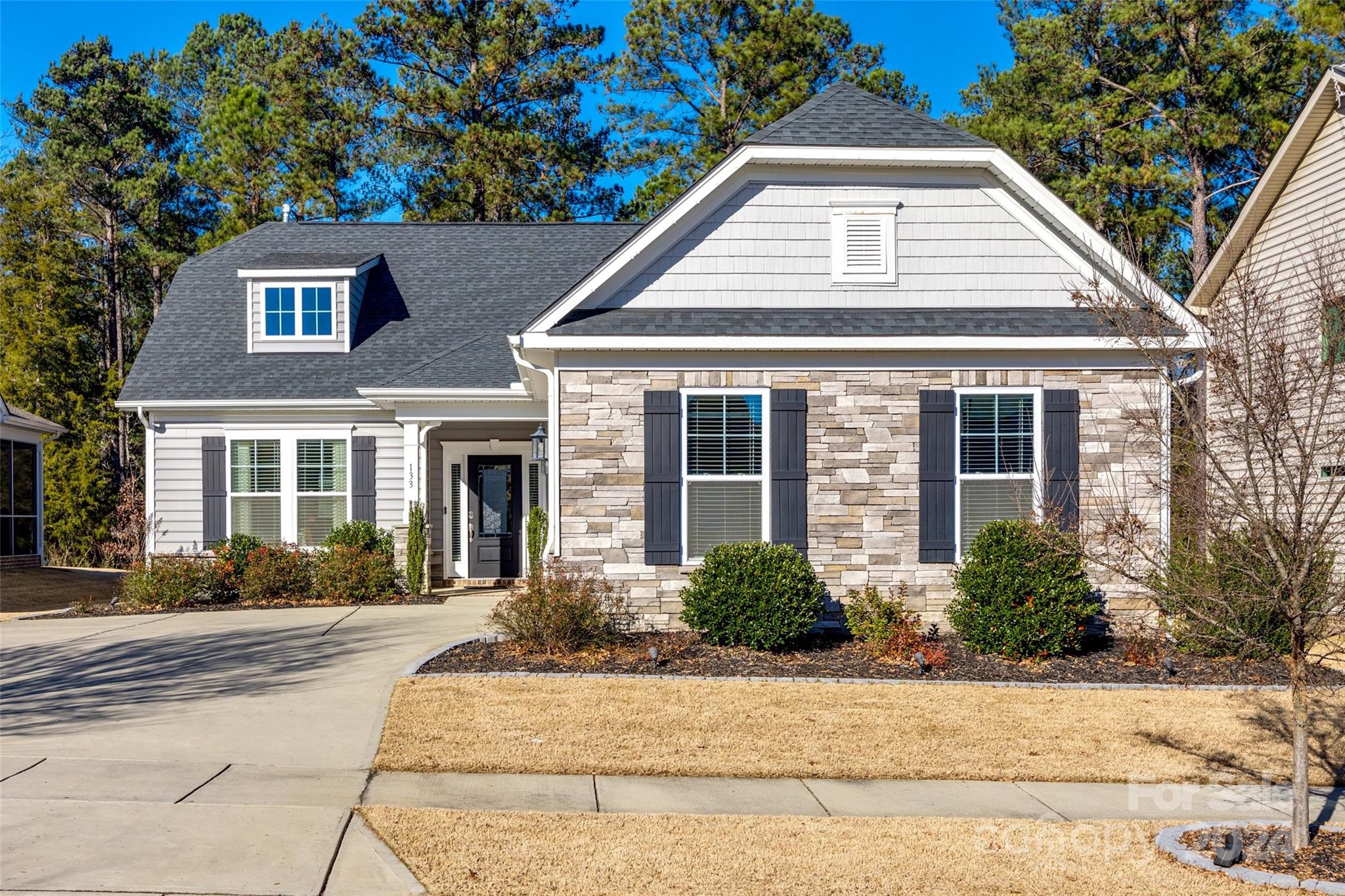 This meticulously maintained 3 bedroom, 3 bath home in Rock Hill’s Timberwood offers over 2000 sq. ft. of functional living space. The stunning kitchen offers upgrades such as a new gas range, instant hot water under the sink, & custom wood shelf liners. The family room features a fireplace adorned with decorative air stone. The home’s main-level features an owner’s suite with a spacious bath & oversized walk-in closet, a second bedroom & full bath as well as screened-in porch with a vaulted ceiling. Upstairs has a third bedroom w/ walk-in closet, full bath & walk-in attic.

Exterior features include a fenced backyard, privacy landscaping, extended concrete grilling patio, and widened driveway. Hardscape borders & landscape lighting enhance the yard. The 2-car garage has upgraded epoxy & polyurethane flooring. Throughout the home, upgraded light fixtures & ceiling fans add functionality and style. This energy-efficient home is move-in ready with thoughtful improvements throughout.