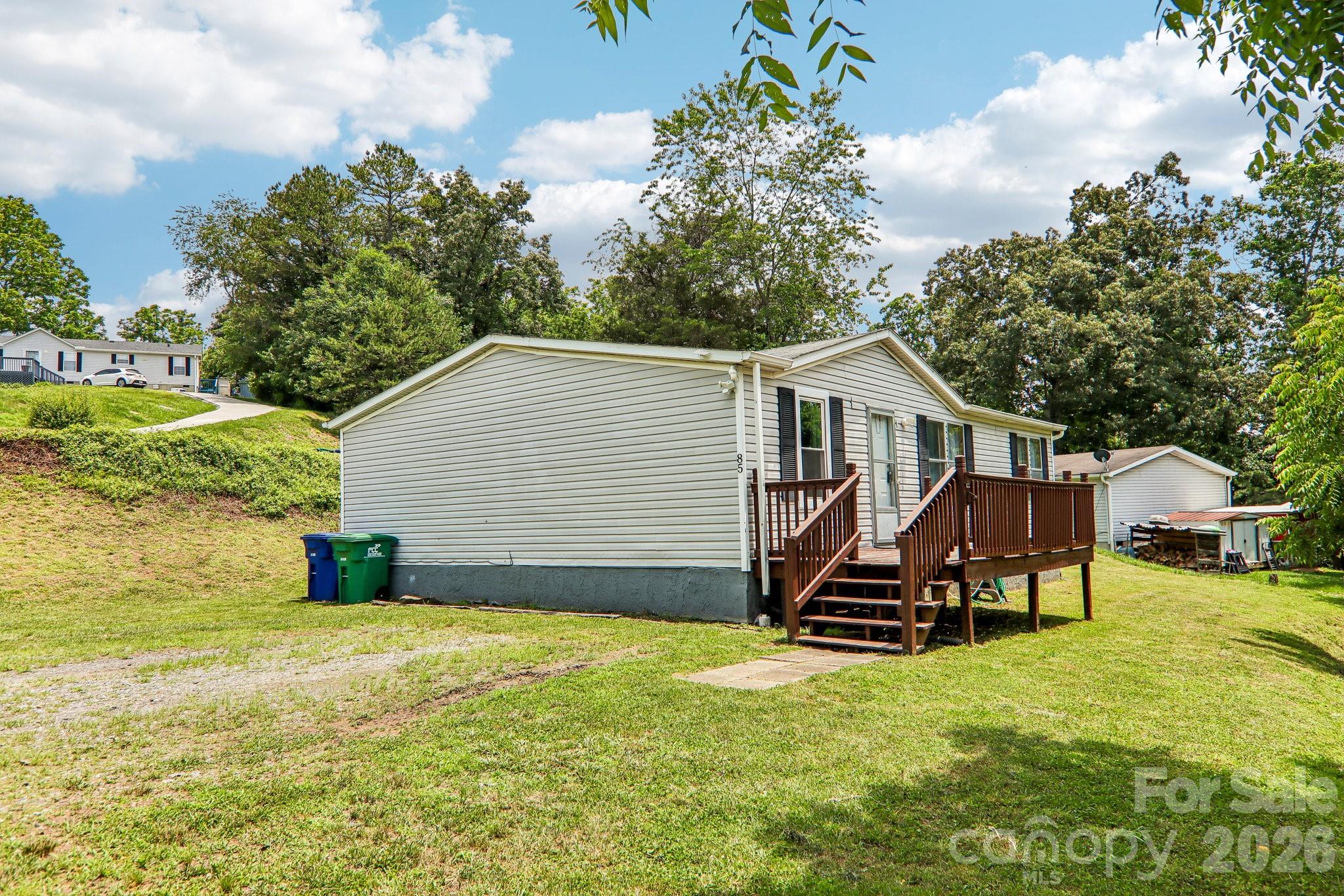 Welcome to your move-in ready home in the serene Hills of French Broad—just 10 minutes north of Asheville! This charming and well-maintained home offers 3 bedrooms and 2 full bathrooms. Step inside to find brand new flooring throughout and freshly painted walls, giving the home a clean, modern feel. Enjoy your mornings and evenings on the large front deck—perfect for grilling, relaxing, and entertaining friends and family. Located in a quiet, friendly community surrounded by natural beauty, this home combines comfort, affordability, and proximity to all that Asheville has to offer. Don’t miss this opportunity—schedule your showing today and make this lovely home yours!