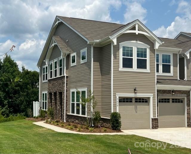 Charming 3 bed, 2.5 bath townhome in the sought-after Indian Land area.  This unique home continues to stun, as it has a 2 car garage, along with a loft upstairs, and a huge pantry in the kitchen.  What a great use of space!  Protected wetland behind the home, fantastic views!  Benefit from proximity to top-rated educational institutions, providing a quality learning environment for residents. with proximity to shopping and dining.  This quality residence features a spacious floor plan, modern kitchen with stainless steel appliances.  Perfect for comfortable and convenient living.  Hope to see you soon!