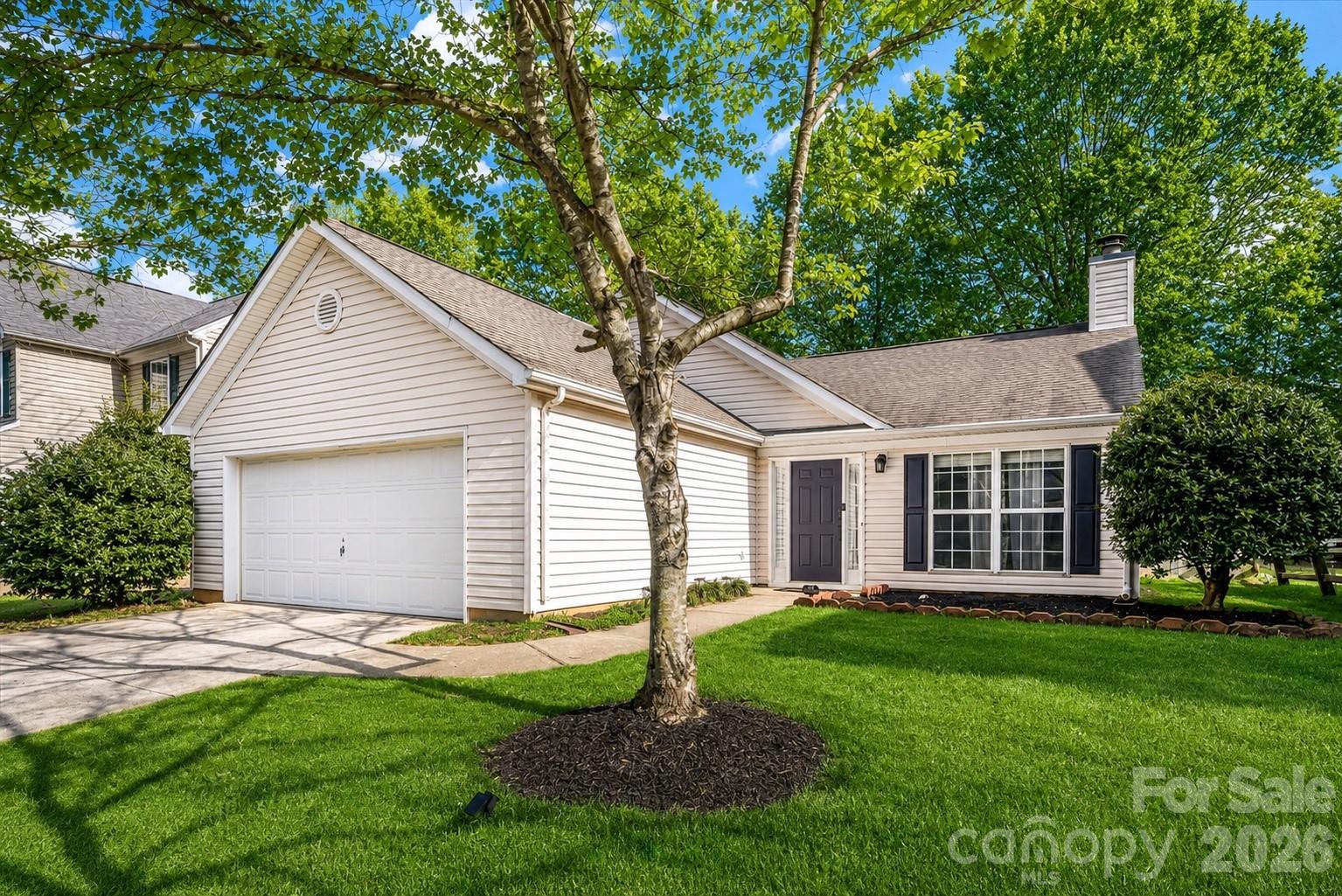 Welcome home to this charming 3-bedroom, 2-bath home in The Crossings at Steele Creek! The inviting family room has vaulted ceilings and a cozy fireplace, creating a warm and open gathering space. The updated kitchen features stainless steel appliances, modern light fixtures, and a bright dining room. The oversized primary suite has vaulted ceilings with a walk-in closet and a beautifully renovated bathroom. Fresh interior paint (2026) and new bedroom carpet (2026) provide a move-in ready feel, while the spacious laundry room adds everyday convenience. Step outside to a private backyard complete with a new fence and a storage shed that conveys with the home. Residents enjoy community amenities including an outdoor pool, clubhouse, playground, recreational areas, and walking trails. Ideally located near shopping, dining, and the airport, this home combines comfort, style, and convenience in one exceptional package.
