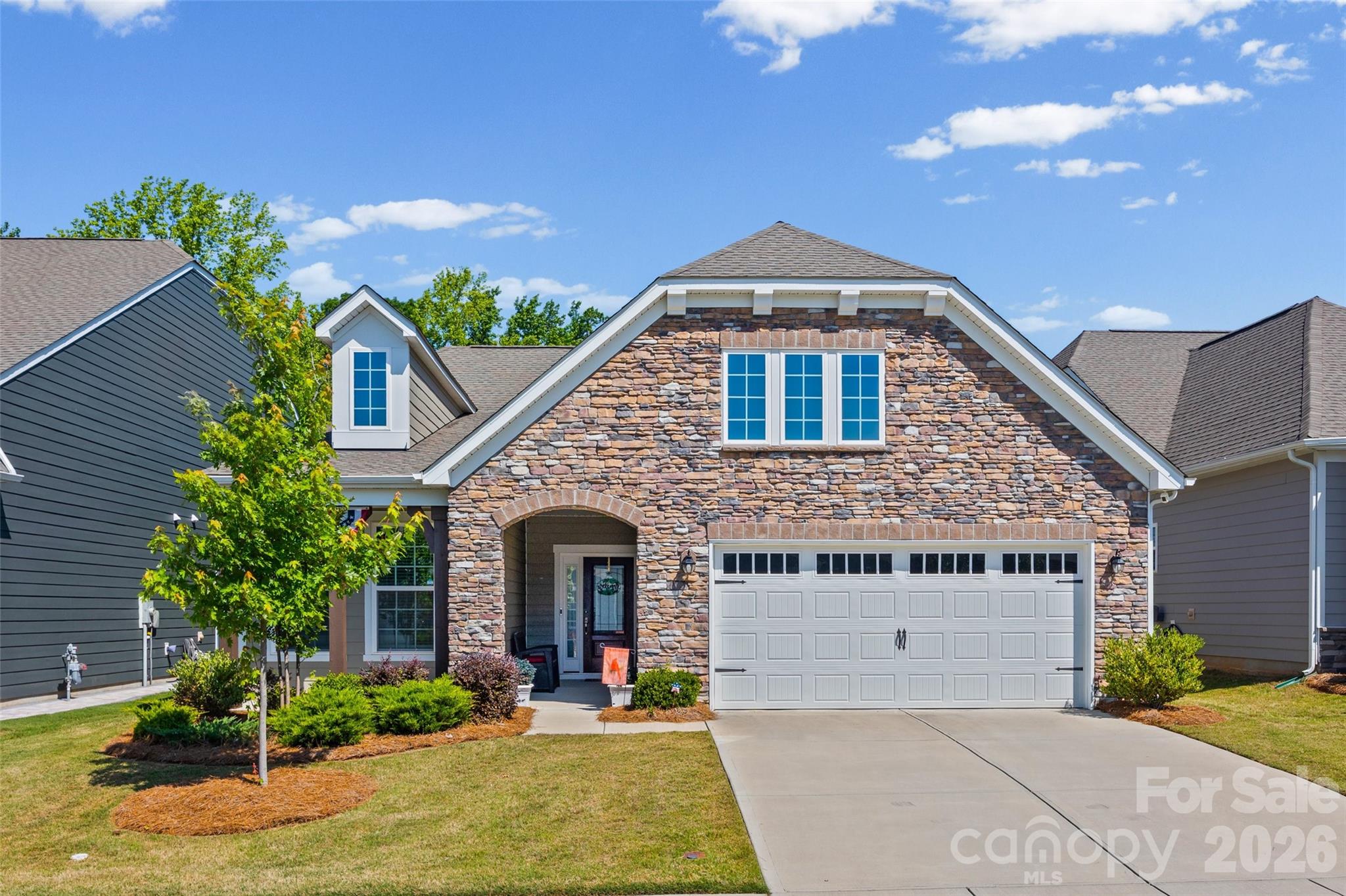 Welcome to 3199 Windhaven Lane!  Nestled in the desirable Windhaven, this home offers an exceptional lifestyle. This 2022 built home offers a perfect blend of comfort and style. The spacious kitchen is a chef's dream with oversized island, sleek SS appliances, white cabinets, and a stylish tile backsplash.  Large, open living room w/built-ins and gas fireplace.
The main-level owner’s suite offers a private retreat with a spacious bath and spacious walk-in closet.
Upstairs, you'll find a flexible loft space along with am extra bedroom/bath. 
Step outside through the screened porch to find a flat, private and fenced backyard.  Perfect for outdoor living.
Enjoy the recreational lifestyle of Tega Cay w/ golf, tennis, swimming, & walking trails. SC taxes. Convenient to shopping, dinning, and I-77.